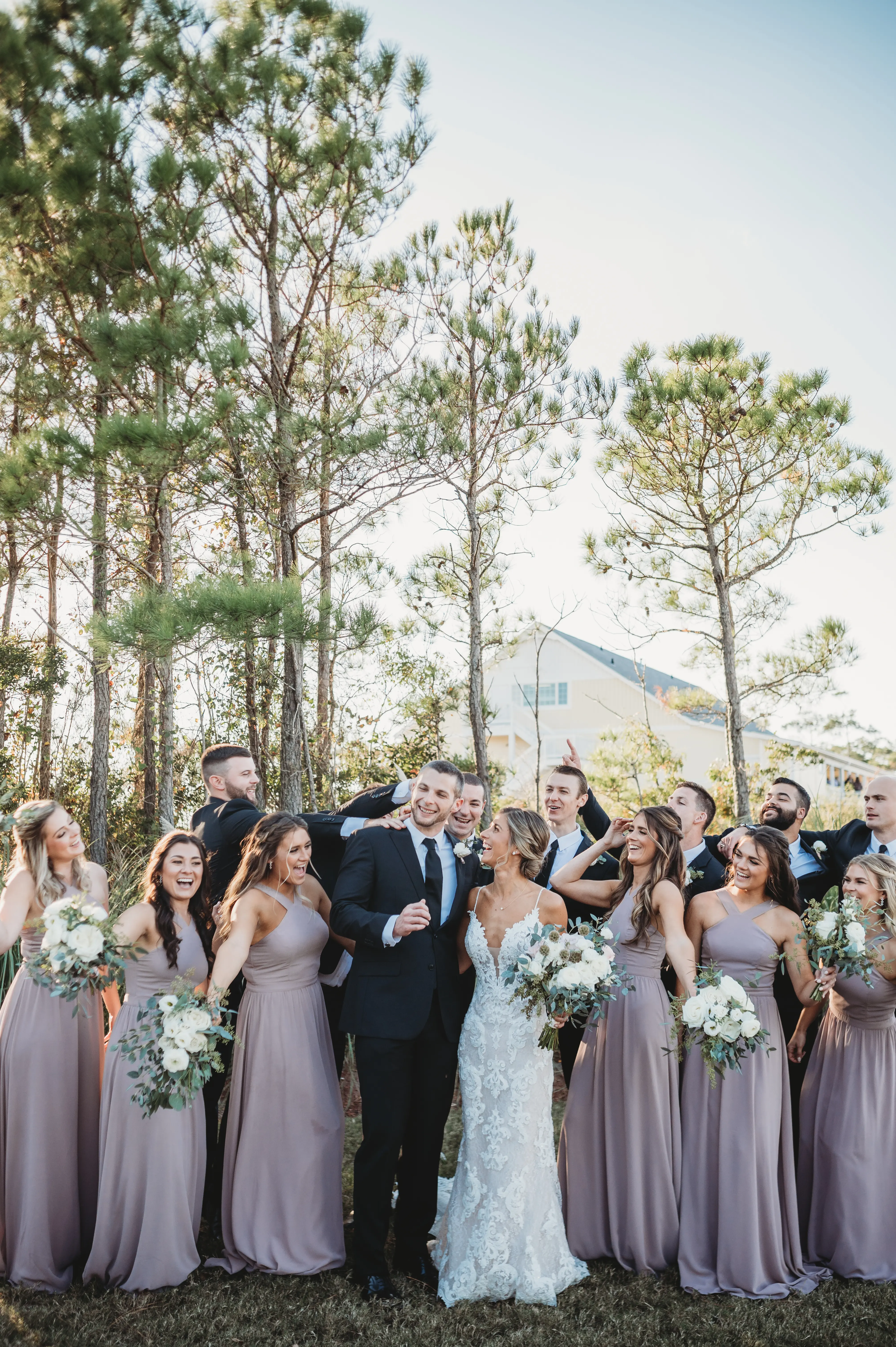 Wedding Party with Bride in Mermaid Wedding Dress with Shimmering Lace Motifs and Illusion Plunging Sweetheart Neckline Called Tuscany by Maggie Sottero