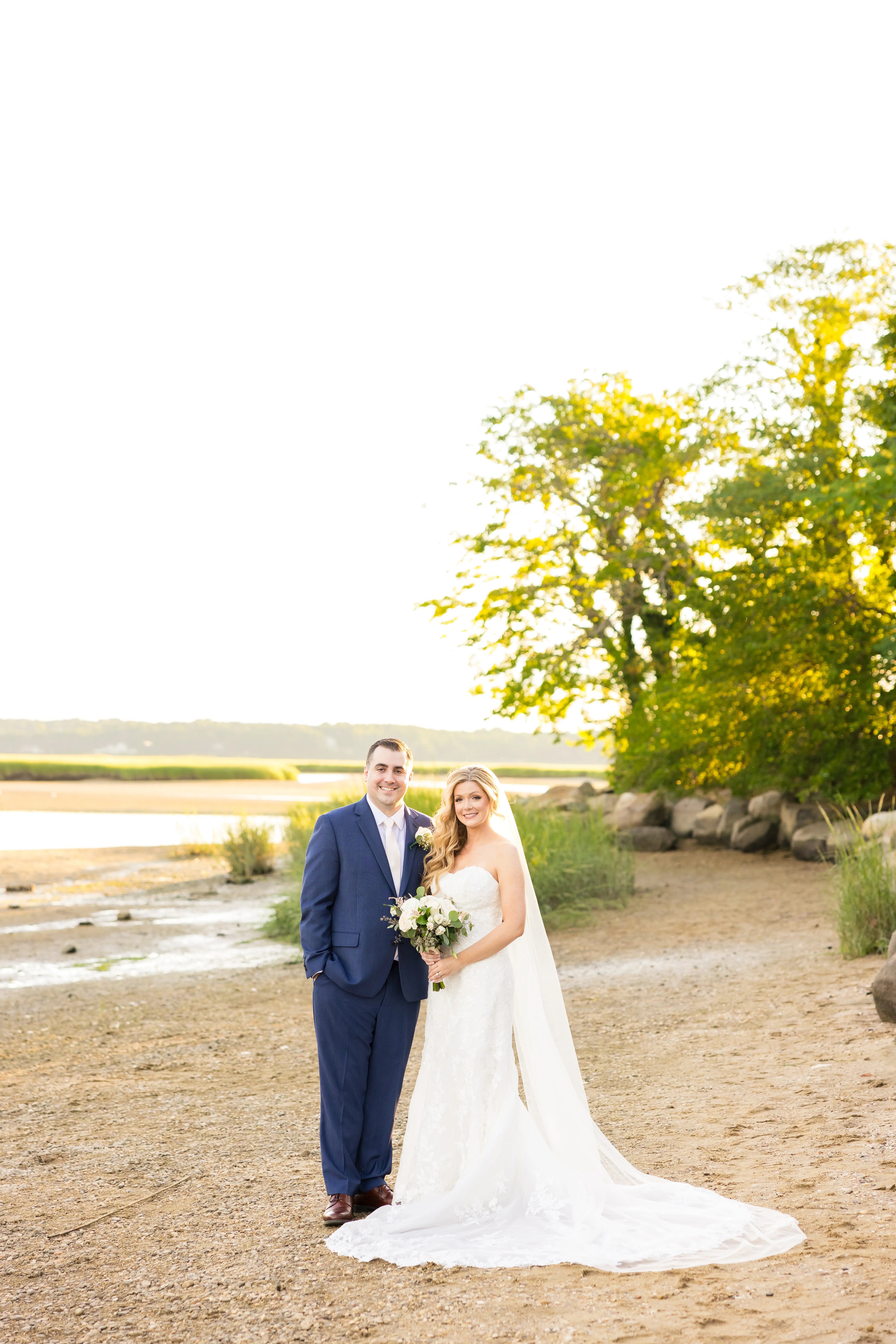 Bride Wearing 3-D Flower Fit-And-Flare Bridal Gown Named Ryker by Sottero and Midgley Bride And Groom By Lake