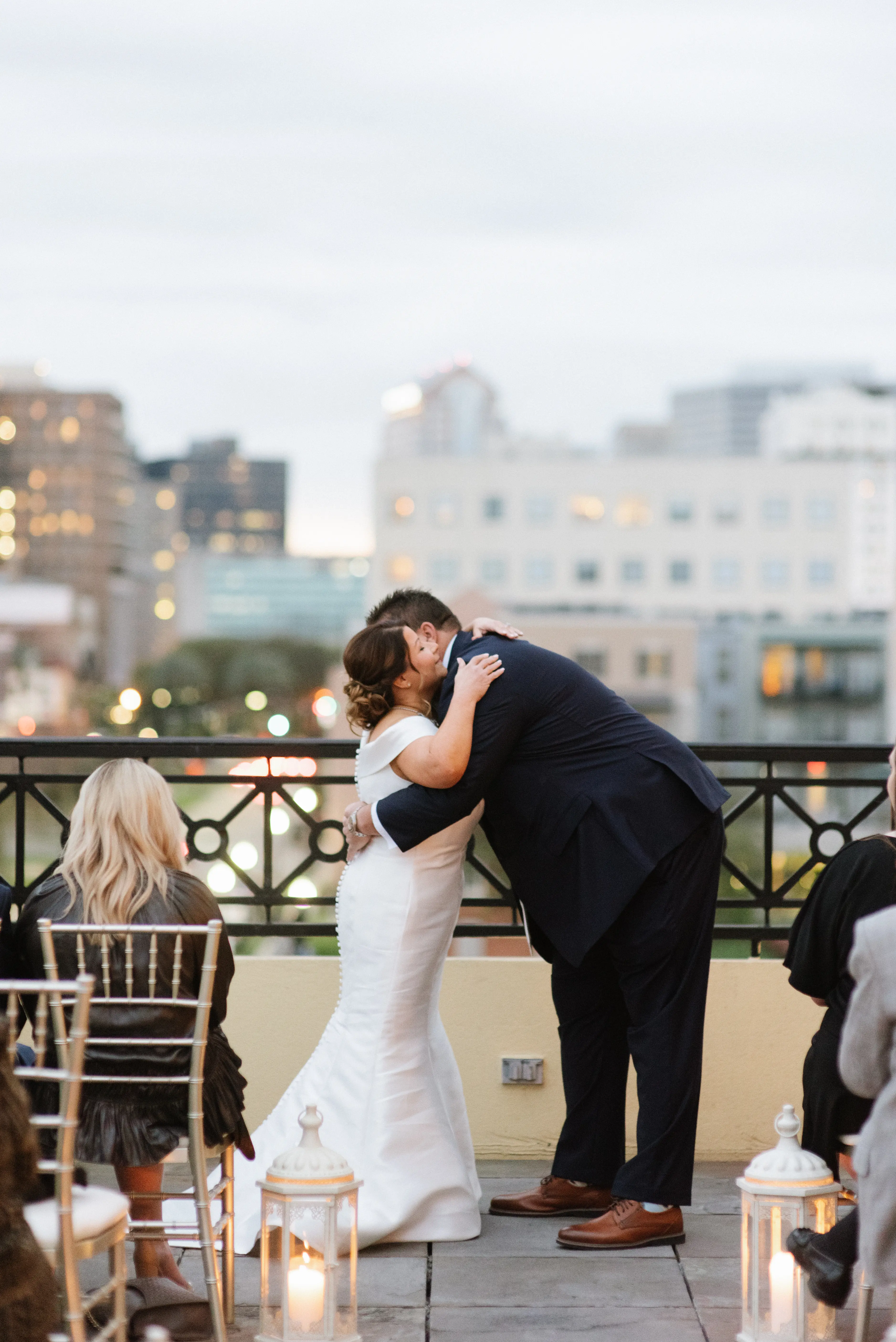 Bride with groom wearing elegant off the shoulder wedding dress
