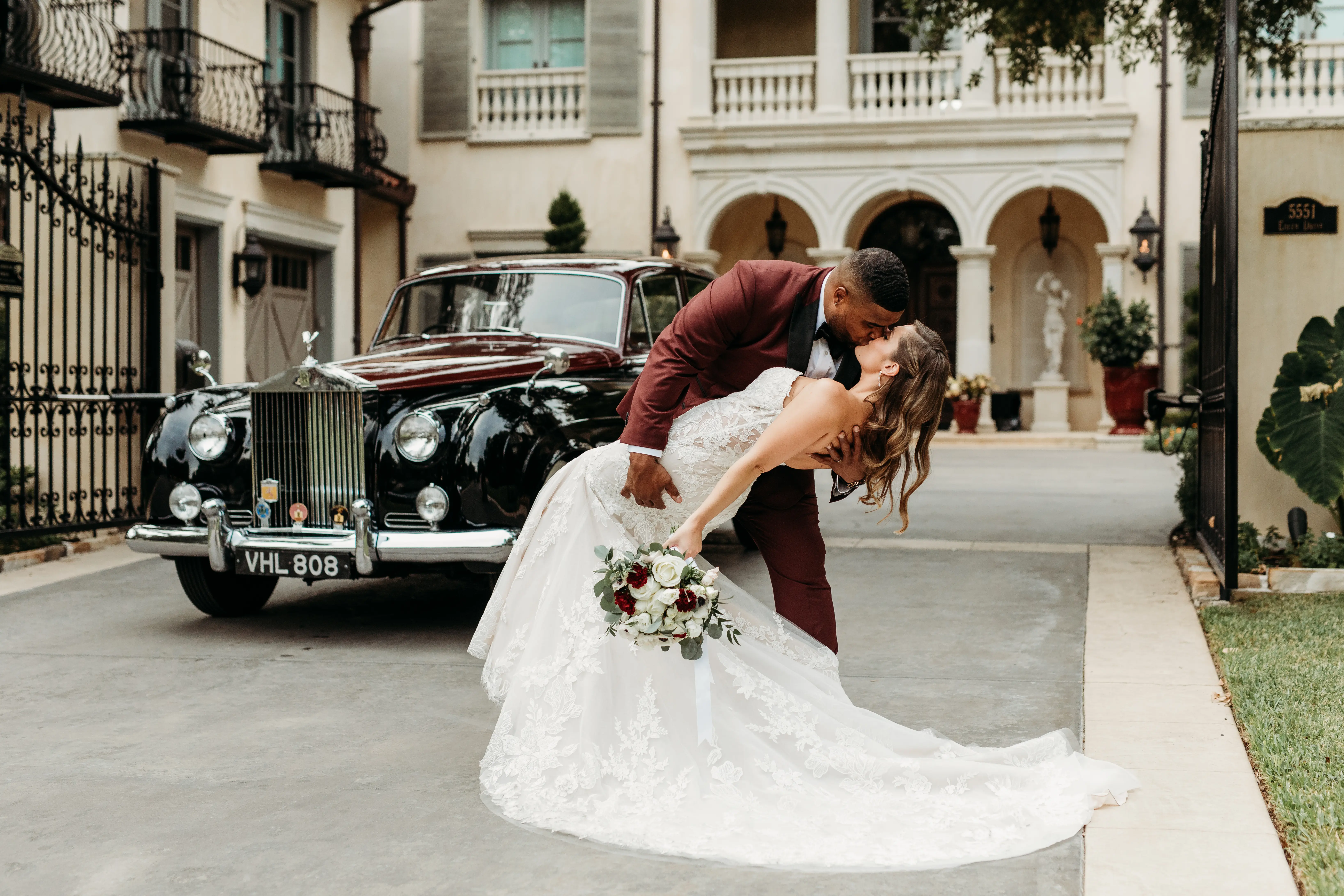 Bride Wearing Lace Mermaid Wedding Gown Called Montgomery By Sottero and Midgley Kissing Groom