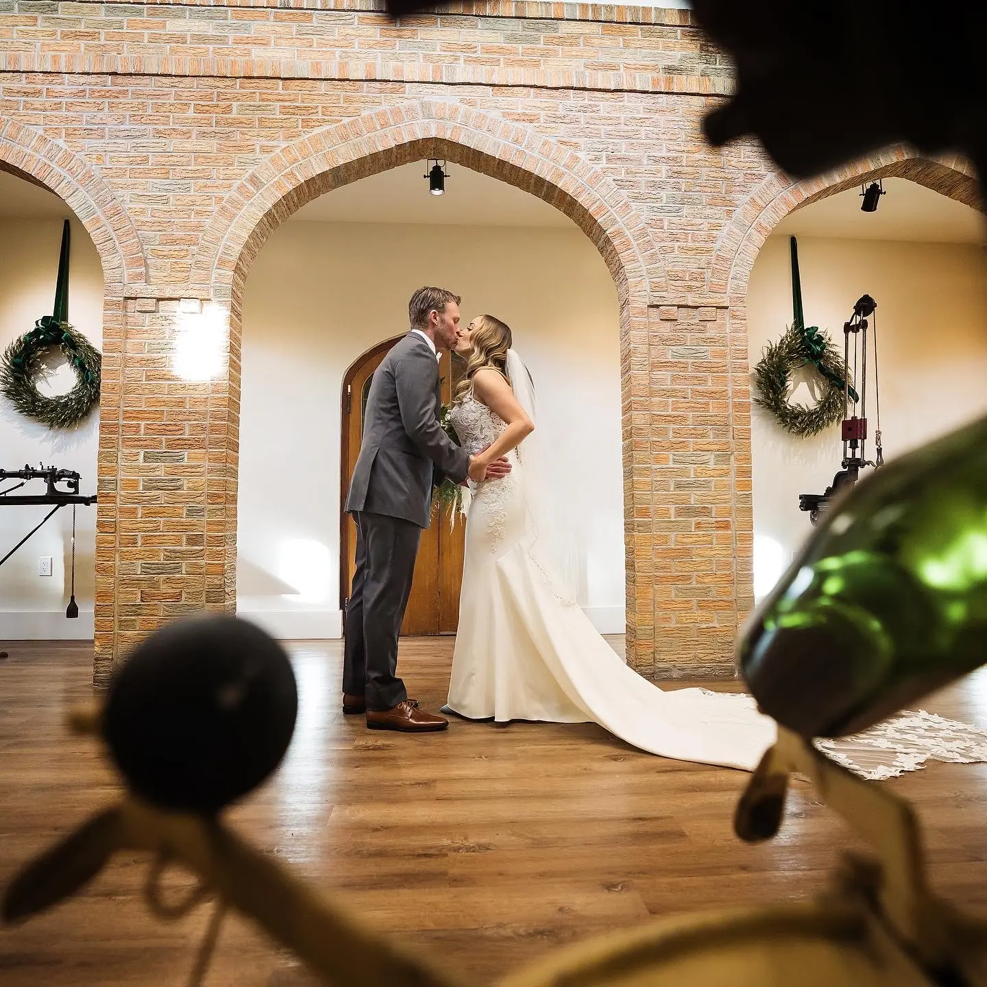 Bride Wearing Lace Mermaid Wedding Gown Called Nikki By Maggie Sottero Kissing The Groom