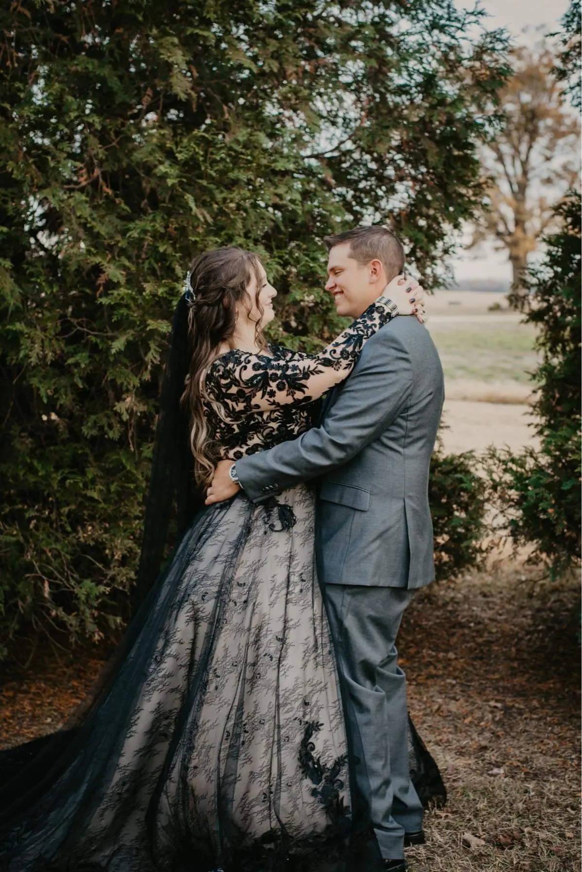 Bride Wearing Black Lace Ballgown Wedding Dress Called Zander By Sottero and Midgley With Groom