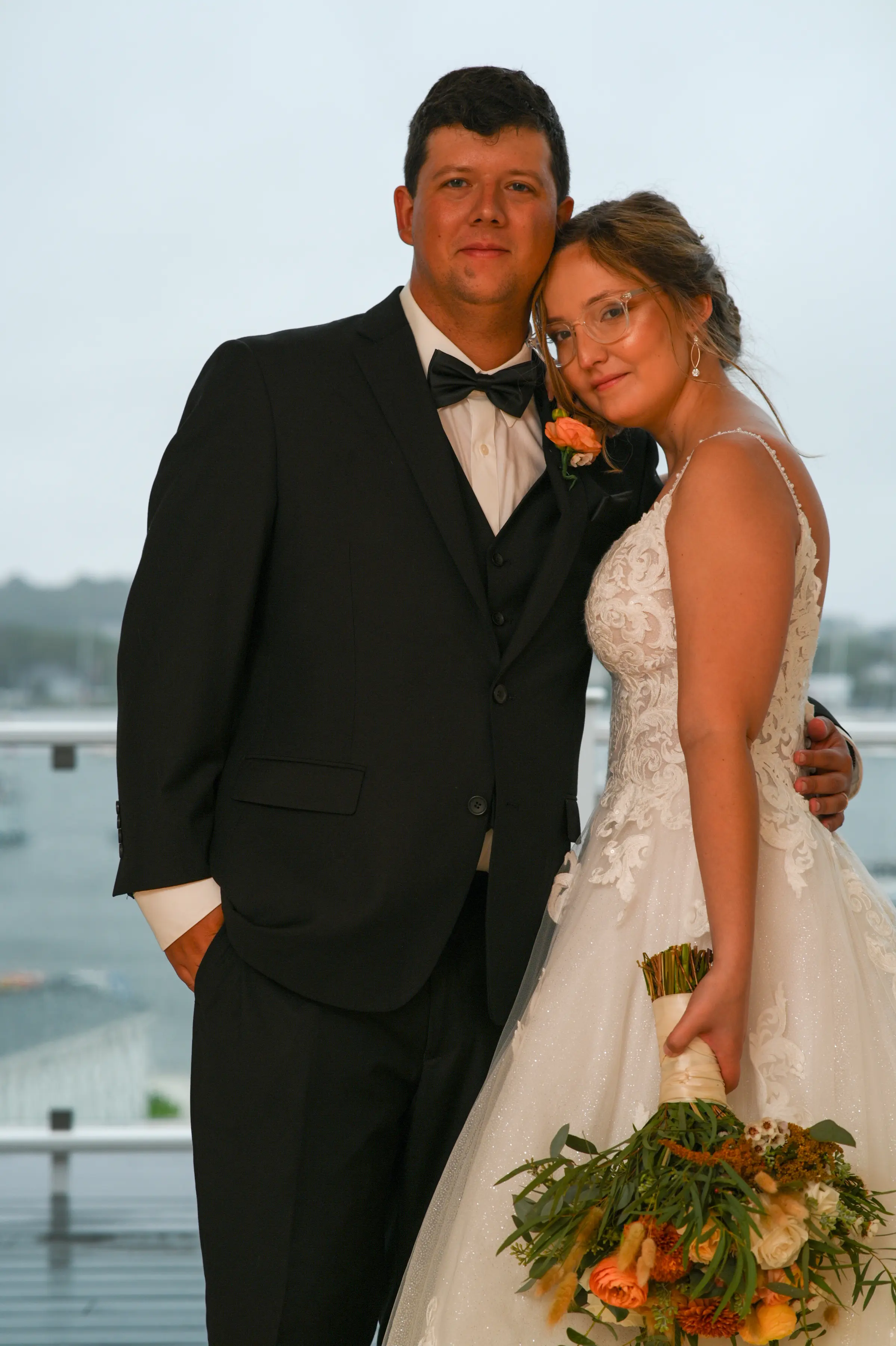 Bride wearing Florence wedding dress by Maggie Sottero with her husband