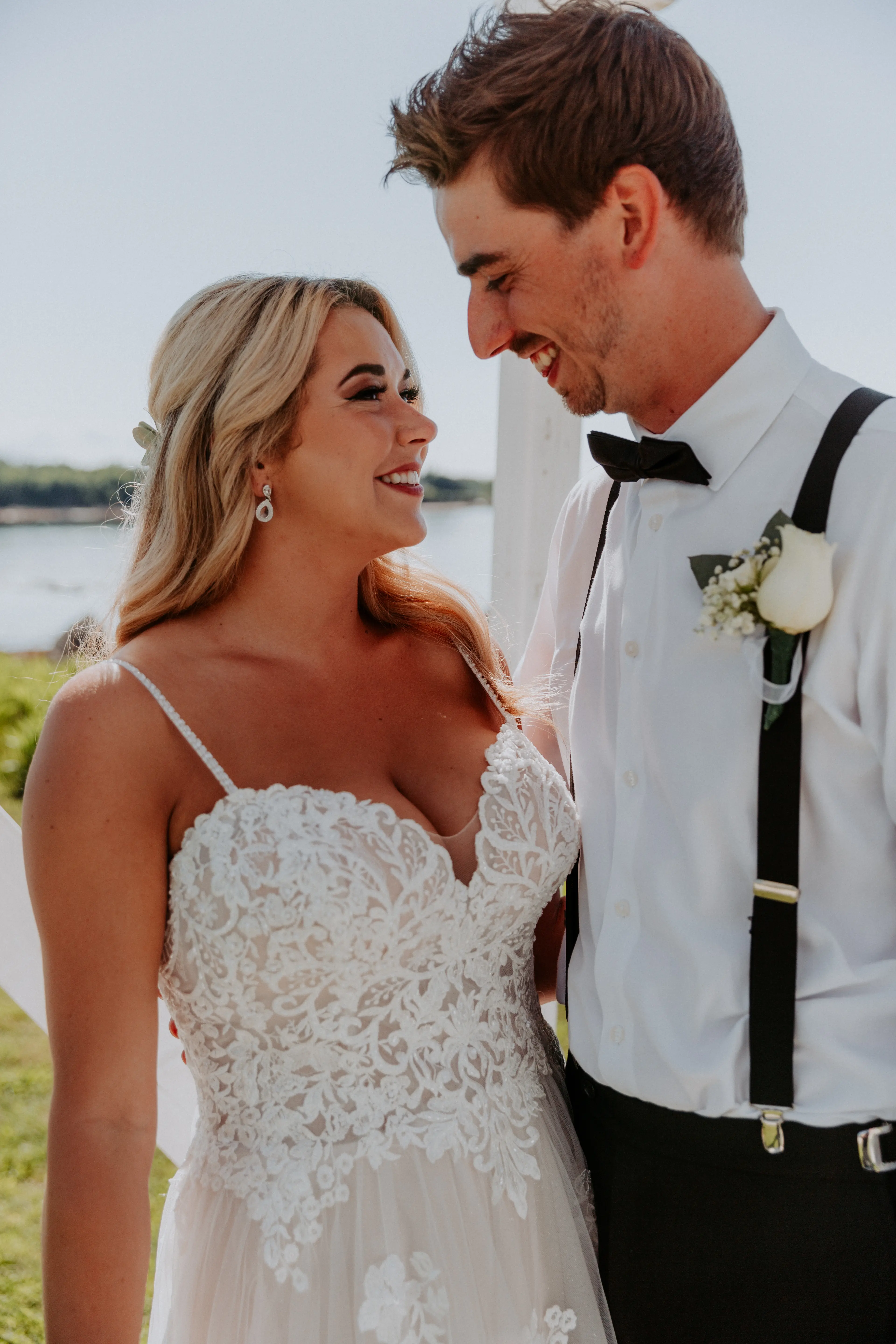 Groom with Bride in Flattering A-Line Spaghetti Strap Wedding Dress with Romantic Lace Called Marisol by Rebecca Ingram