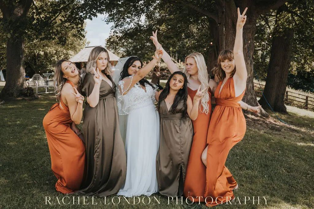 Bride In Textured A-line Lorraine Rebecca Ingram With Bridesmaids In Brown And Orange