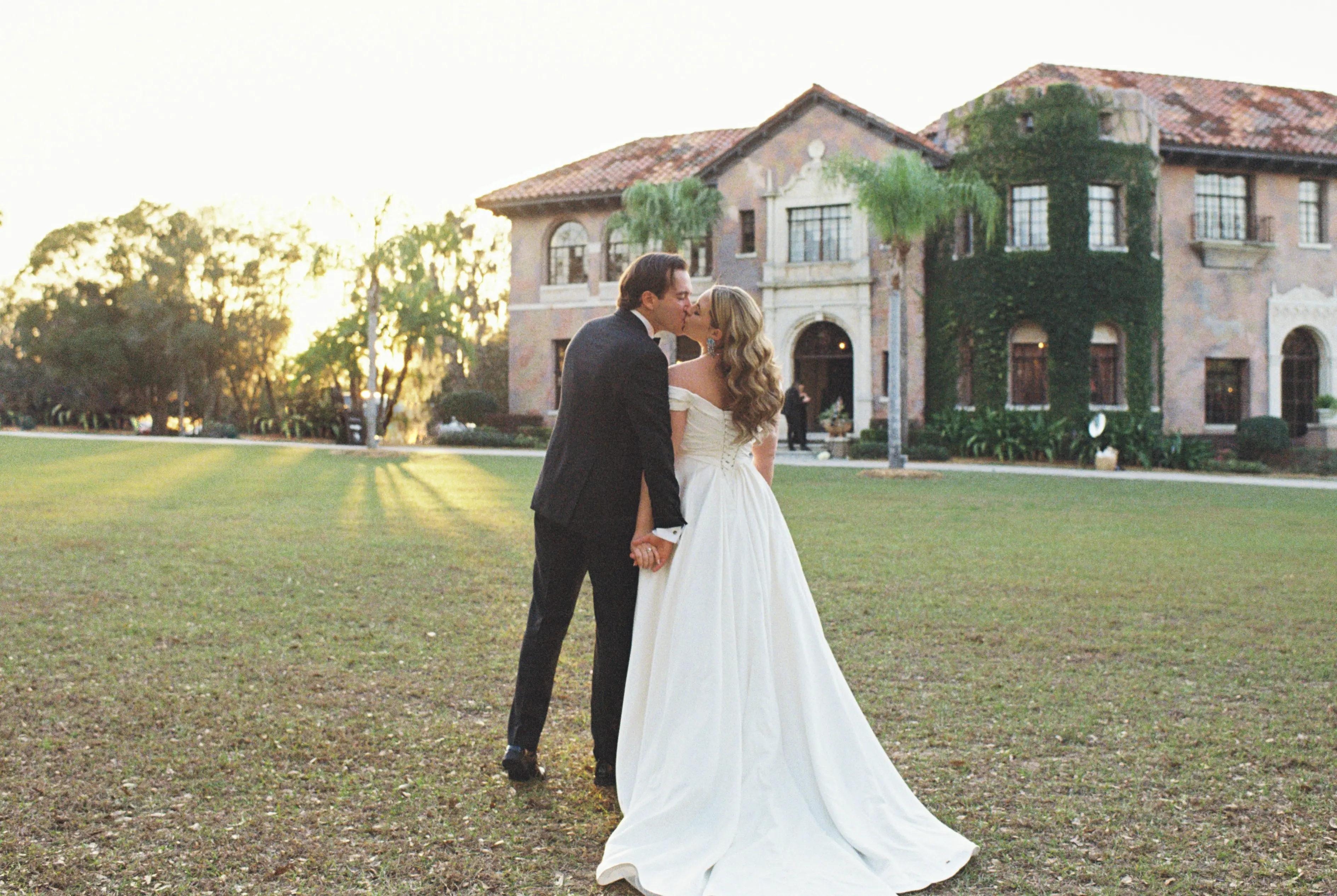 Bride wearing Ekaterina by Maggie Sottero kissing her husband