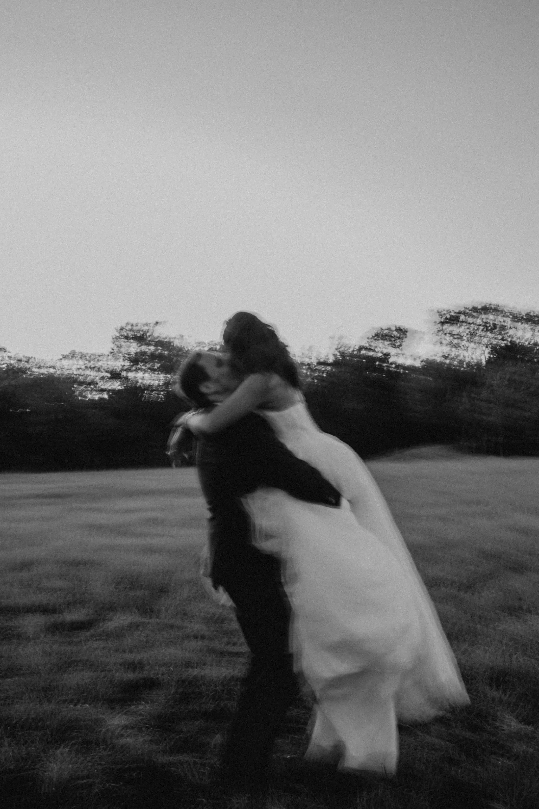 Bride Wearing Sparkly Ballgown Wedding Dress Called Zartasha By Sottero and Midgley Kissing The Groom