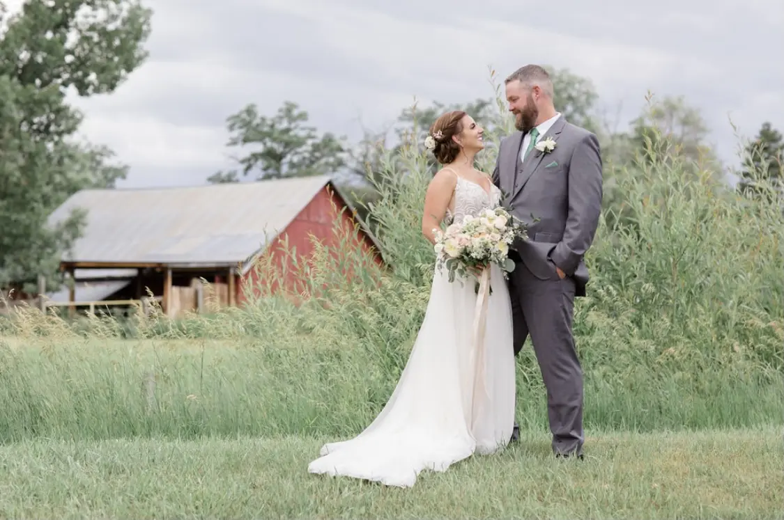 Groom With Bride Wearing Relaxed A-Line Wedding Dress Called Charlene By Maggie Sottero
