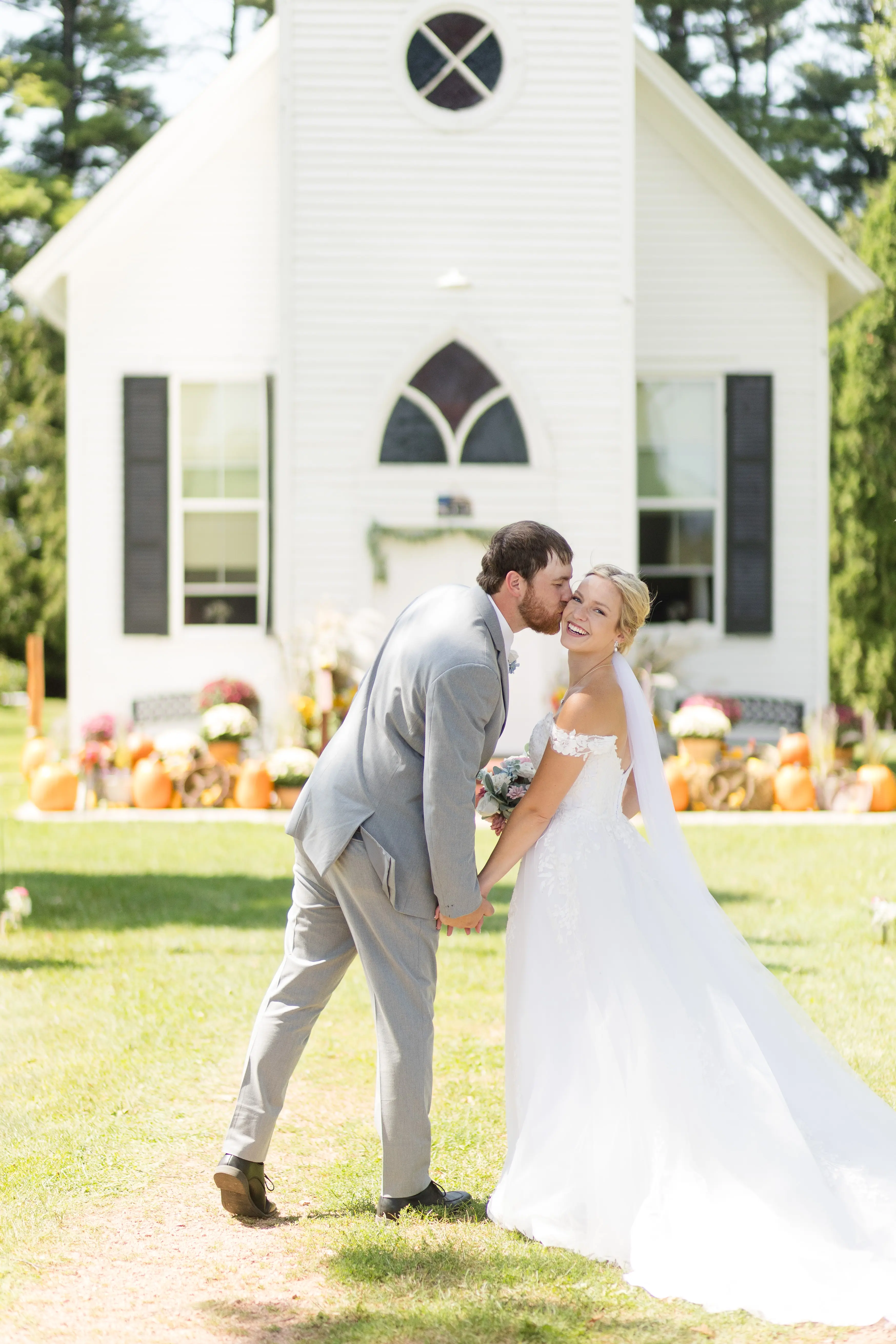 Groom Kissing Bride Wearing Ballgown Wedding Dress Called Harlem By Maggie Sottero