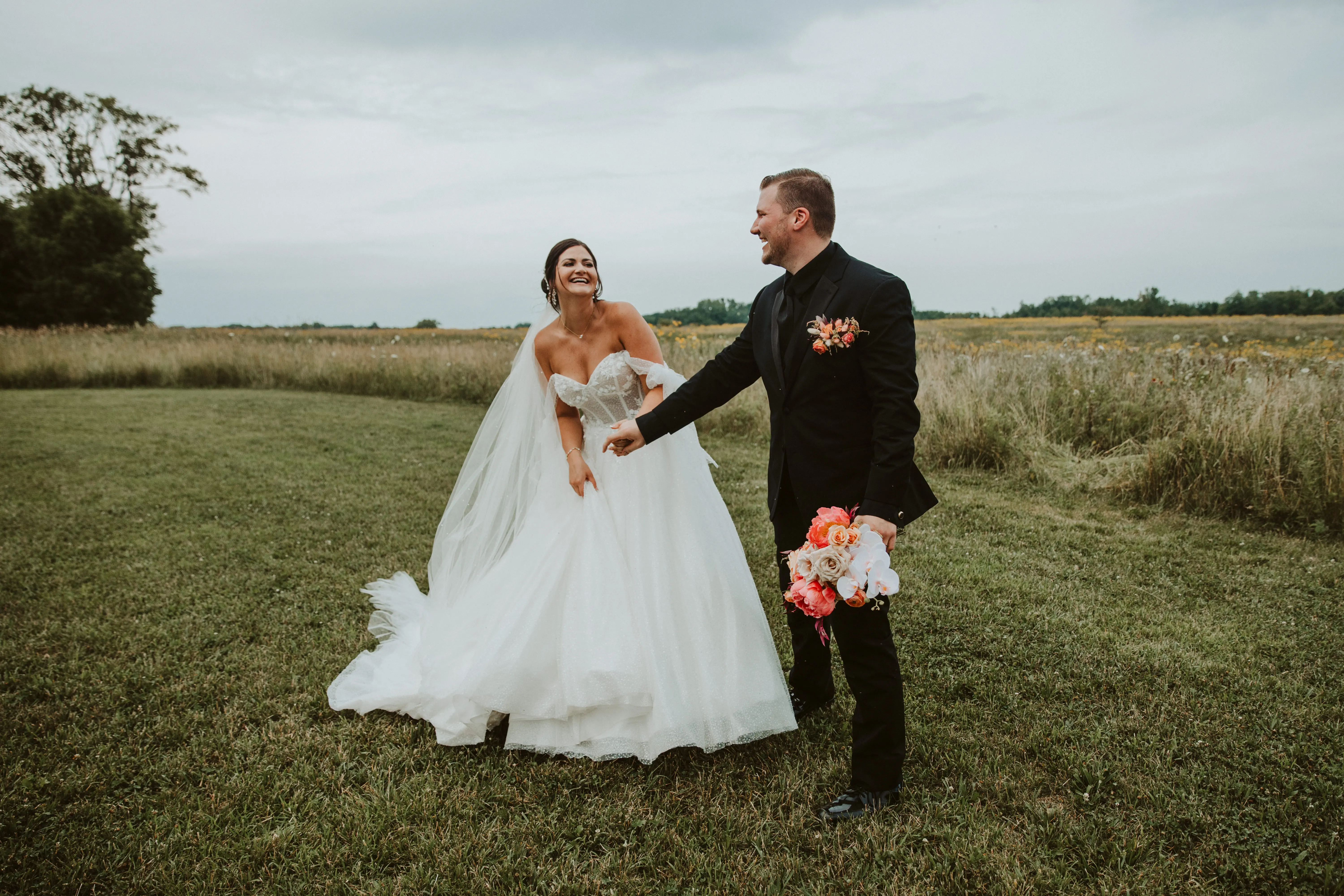 Bride Wearing Sparkly Ballgown Wedding Dress Called Shasha By Sottero And Midgley Holding Hands With Groom
