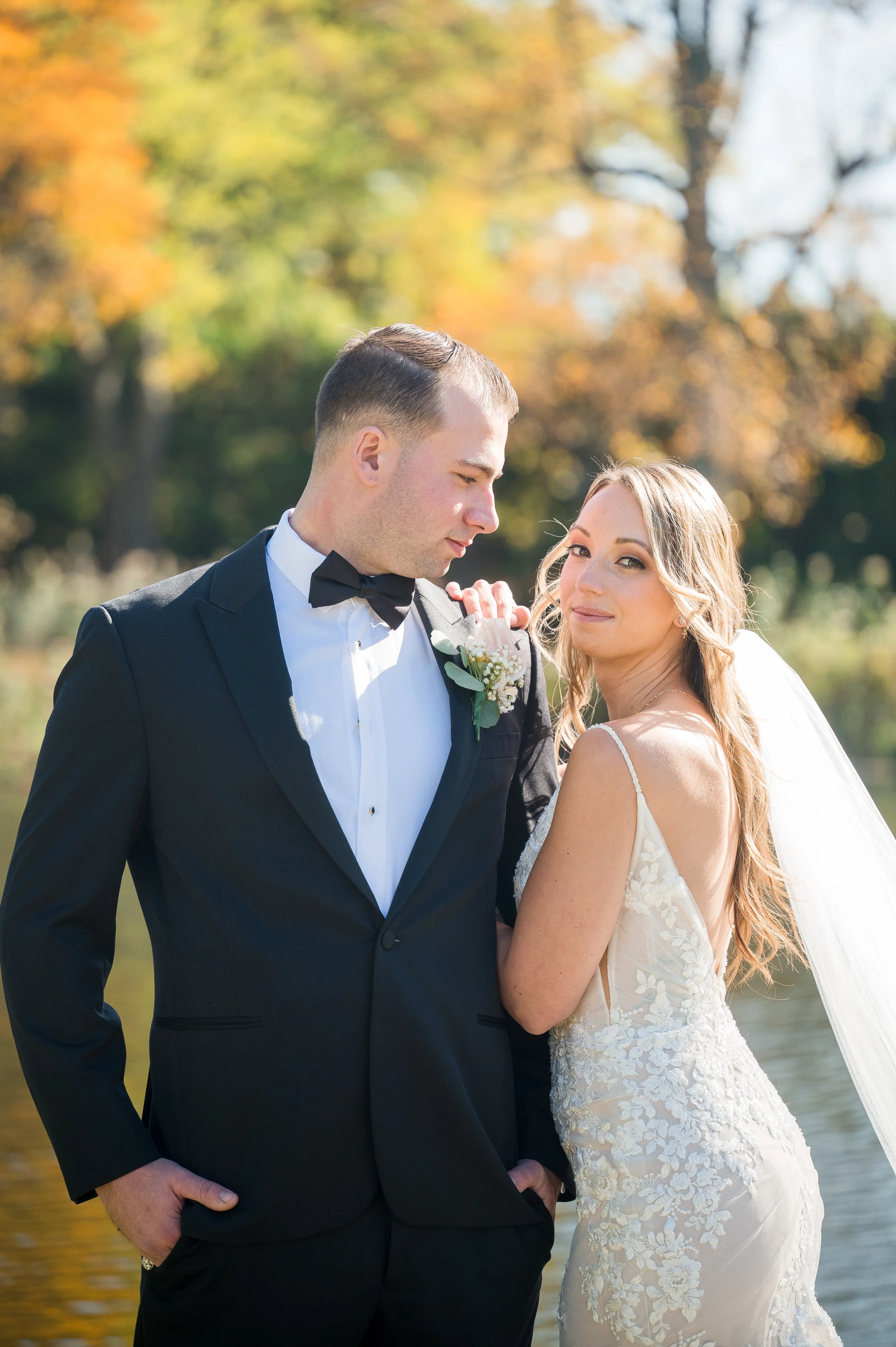 Real bride in sparkly lace fit-and-flare bridal gown with lace motifs over tulle called Fontaine by Maggie Sottero