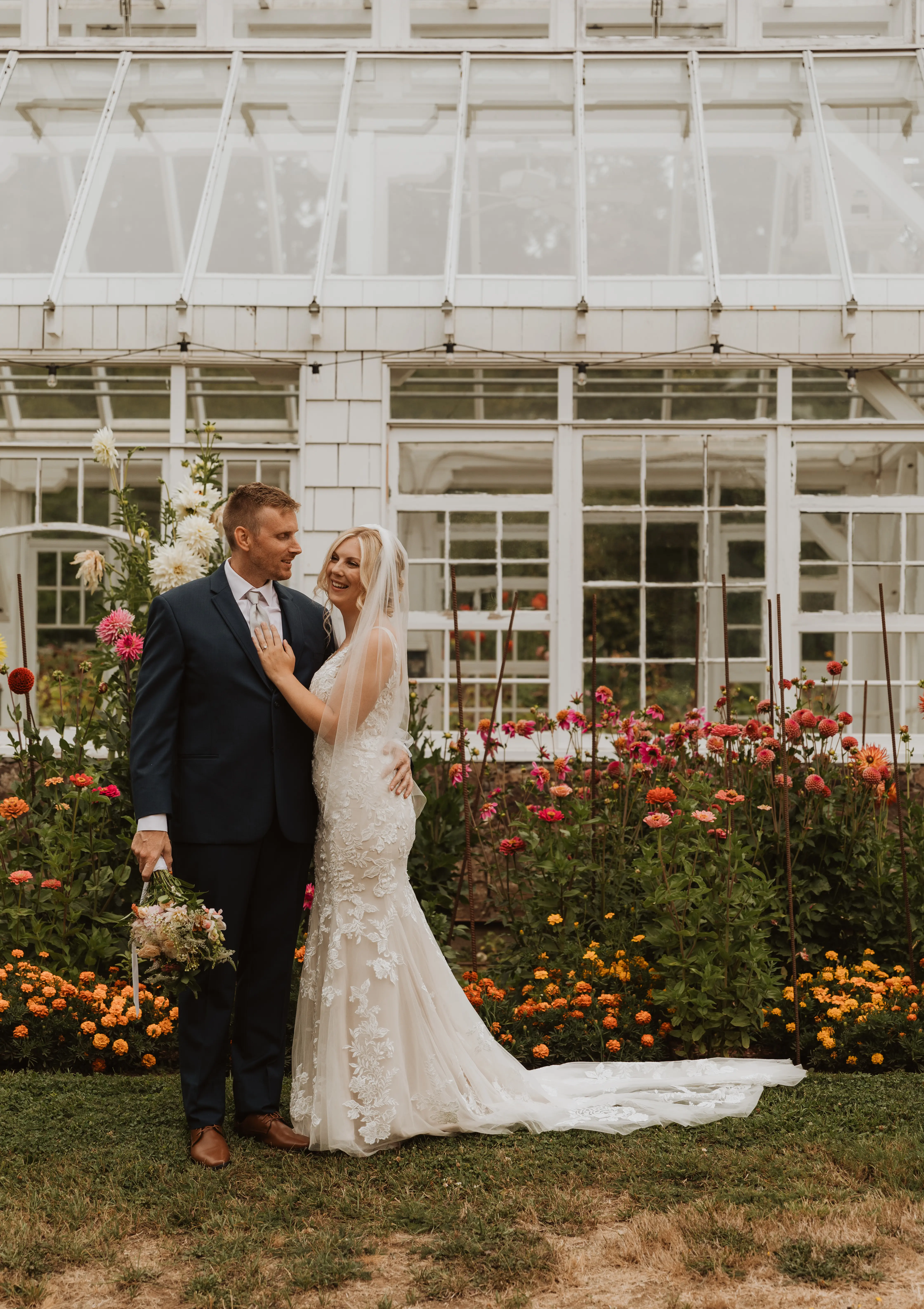 Bride wearing Greenley wedding dress by Maggie Sottero with her husband