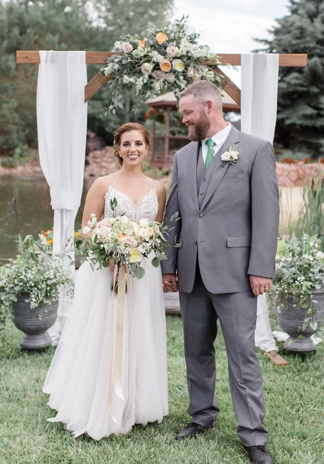 Groom With Bride Wearing Relaxed A-Line Wedding Dress Called Charlene By Maggie Sottero