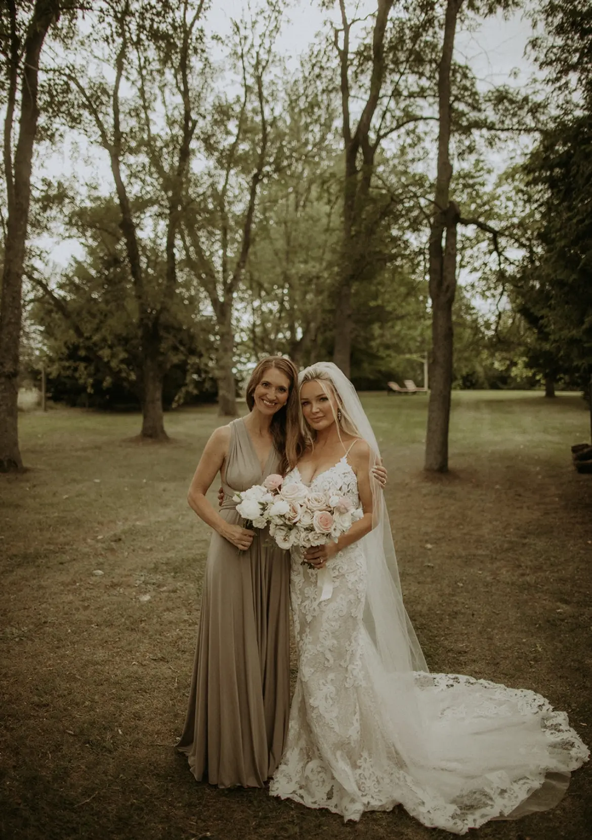 Bride wearing Lace Fit-and-Flare Wedding Dress called Tuscany Lynette by Maggie Sottero with her maid of honor