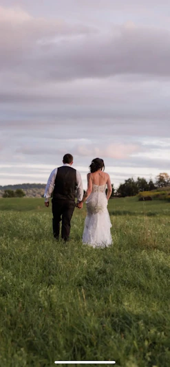 Groom With Bride Wearing Lace Sheath Wedding Dress Tuscany Lynette By Maggie Sottero