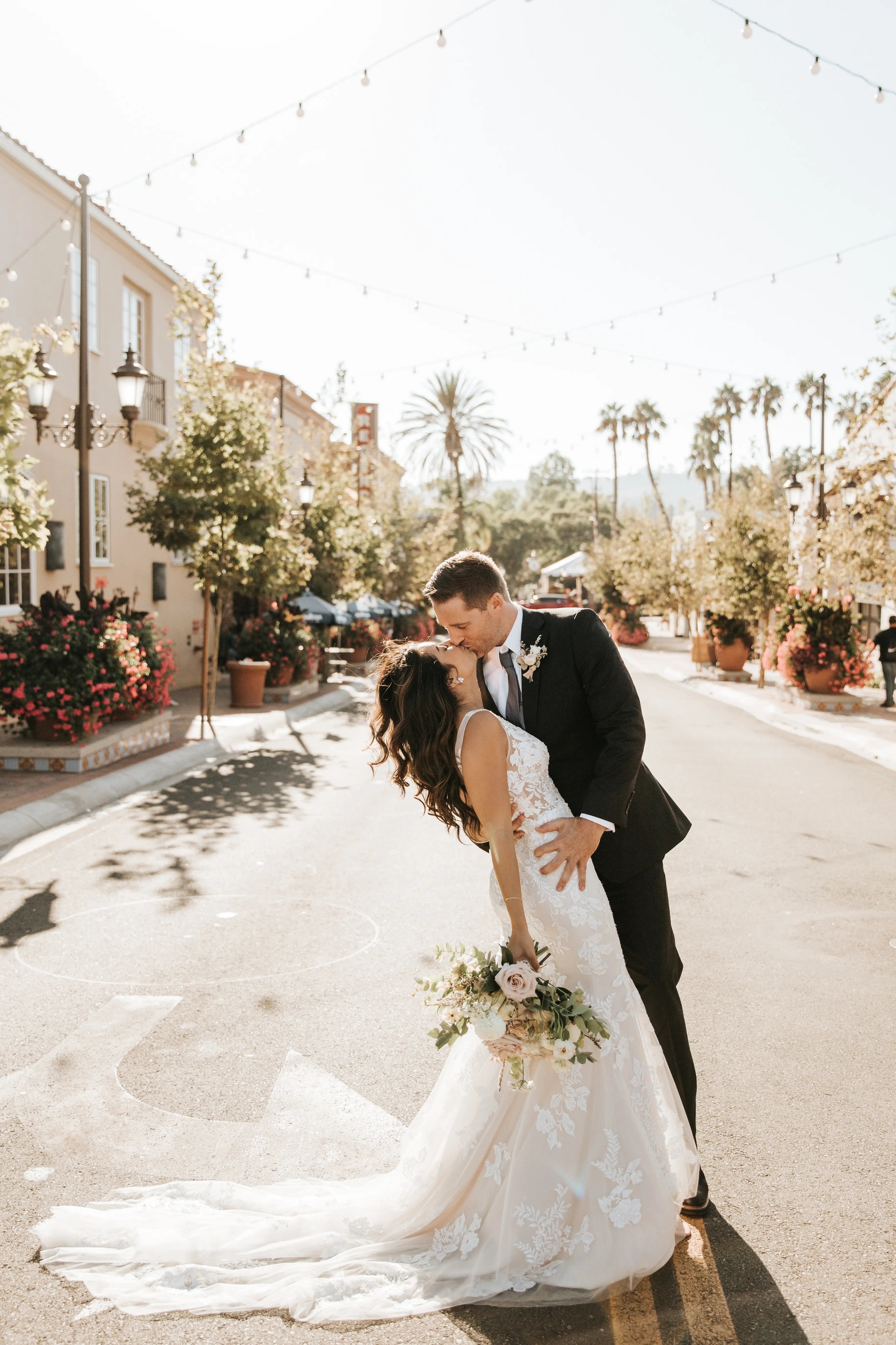 Bride with groom wearing floral fit and flare wedding dress
