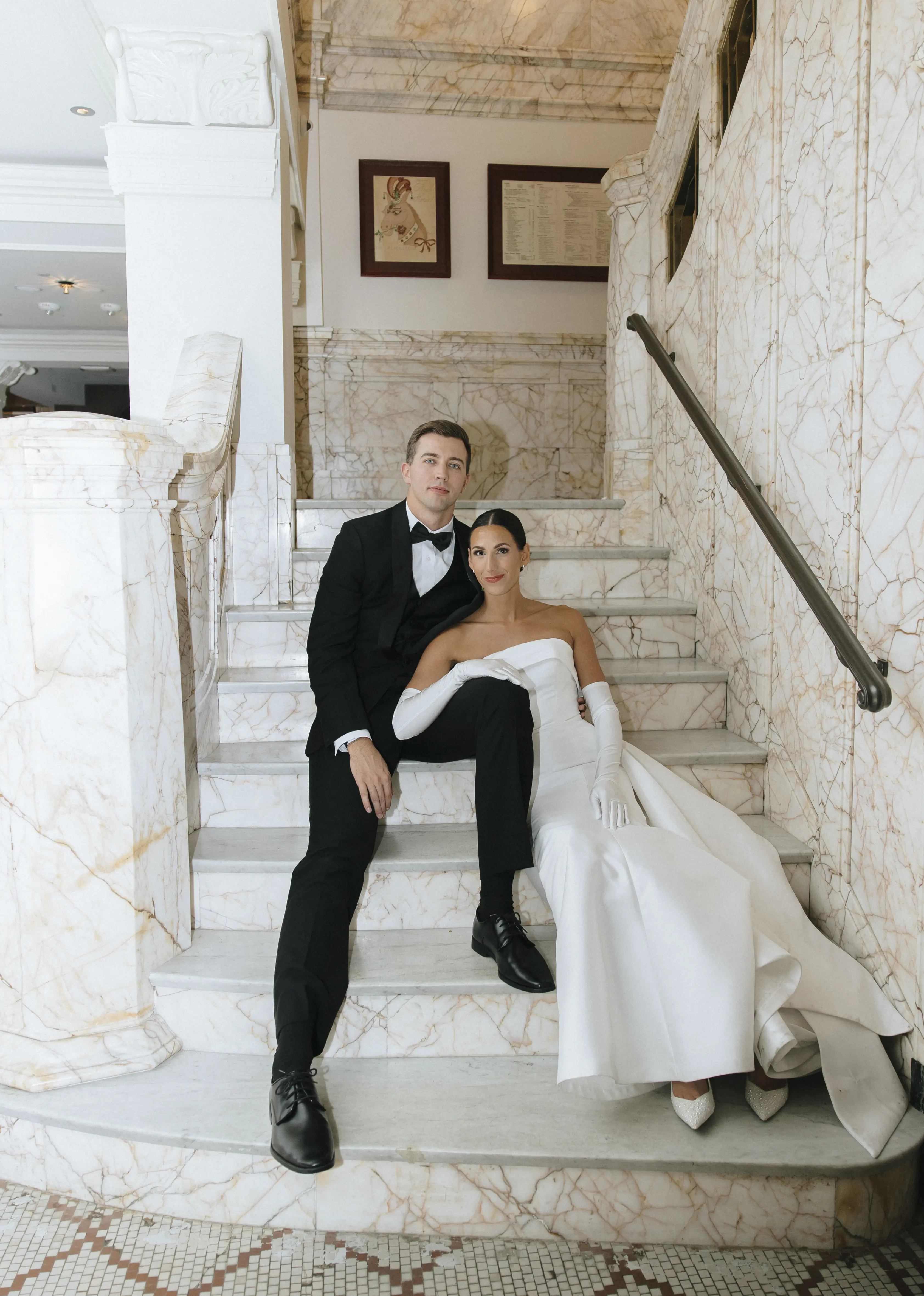 Bride wearing Mitchell wedding dress by Maggie Sottero sitting with her husband
