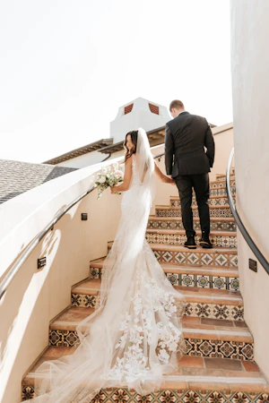 Bride with groom wearing floral fit and flare wedding dress