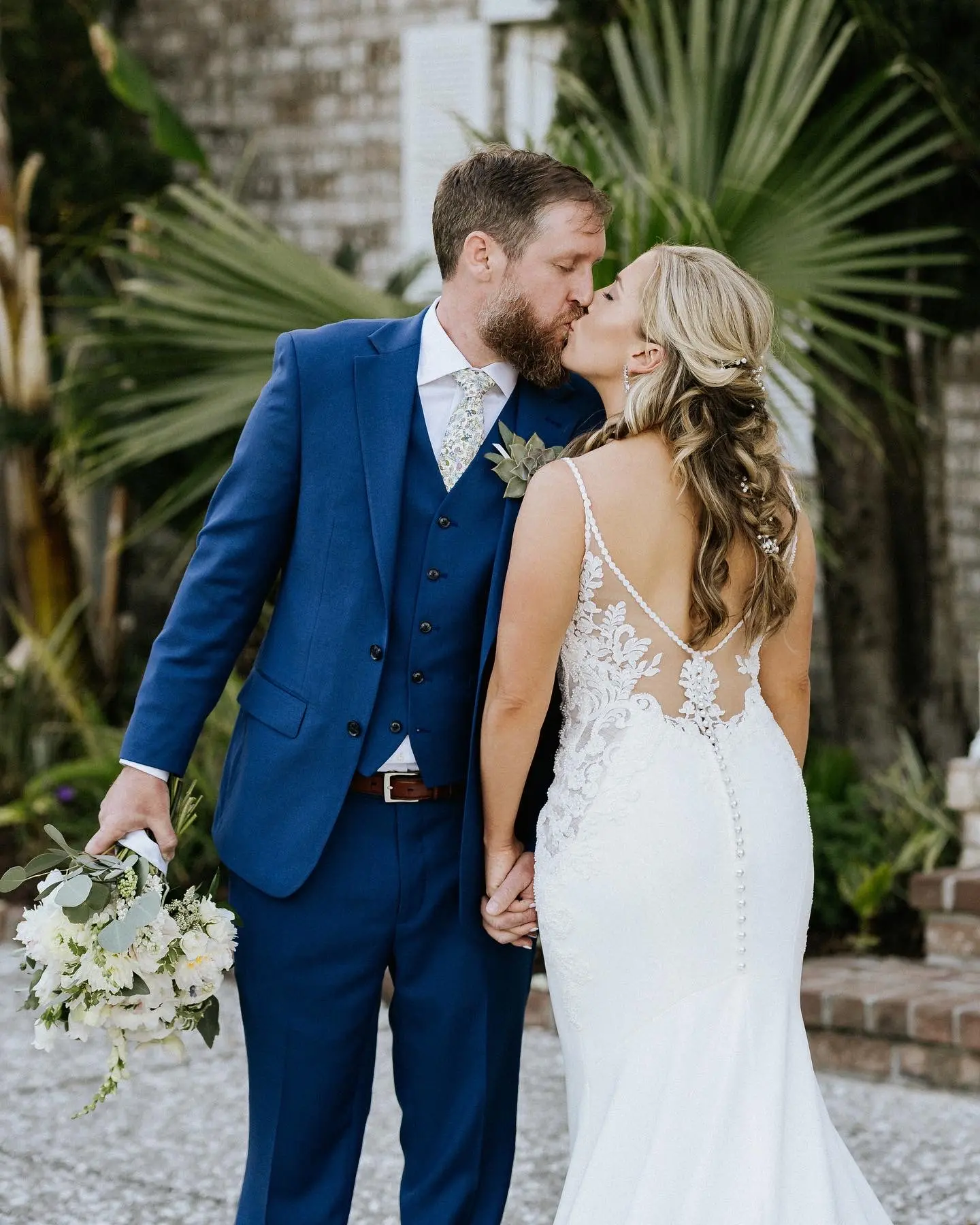 Groom Kissing In A Stunning Lace Spaghetti Strap Mermaid Wedding Dress Named Nikki By Maggie Sottero