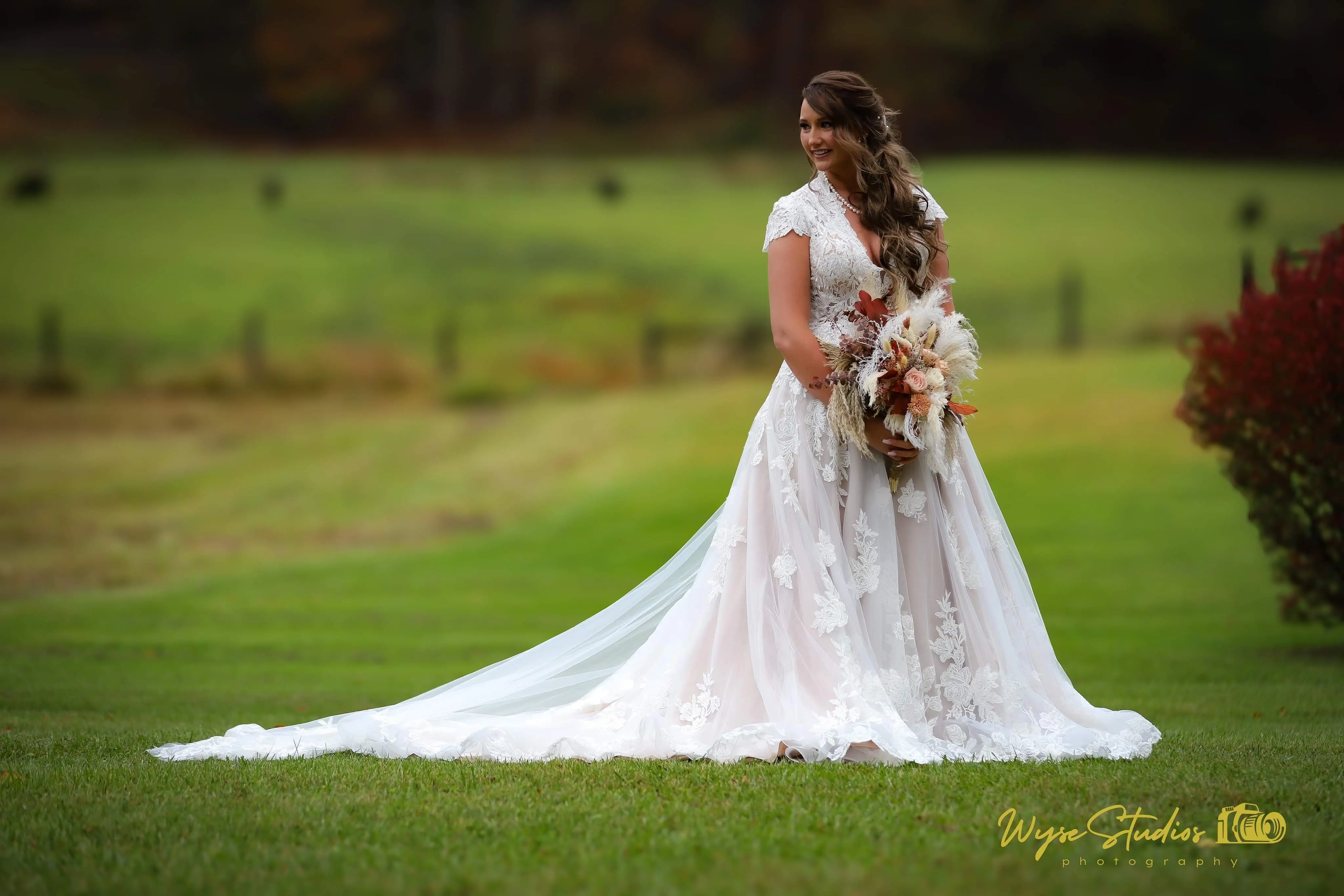 Bride wearing Kingsley wedding gown by Sottero and Midgley