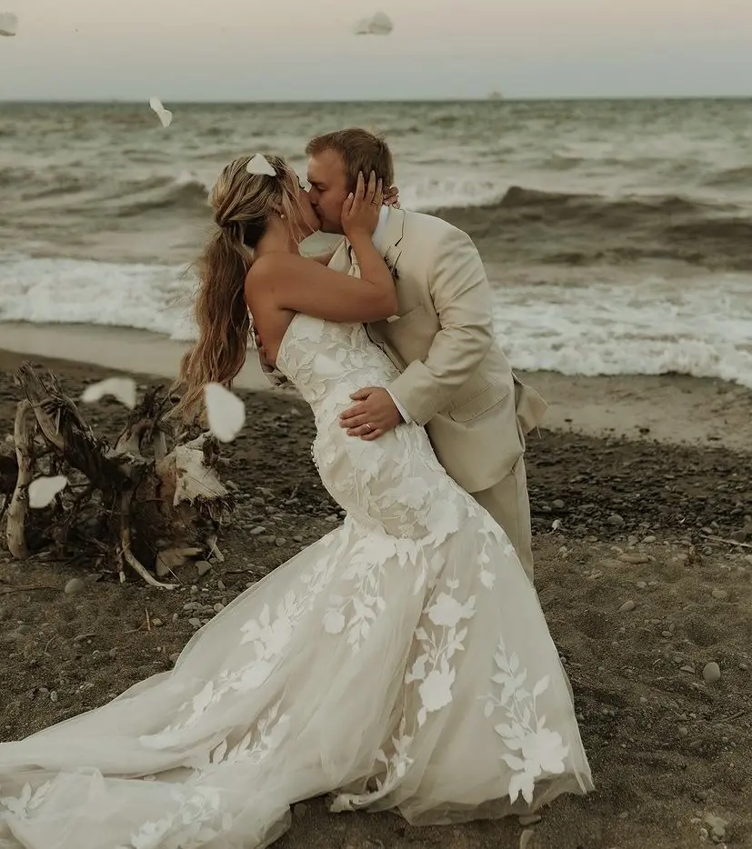 Bride wearing Hattie wedding dress by Rebecca Ingram kissing her husband