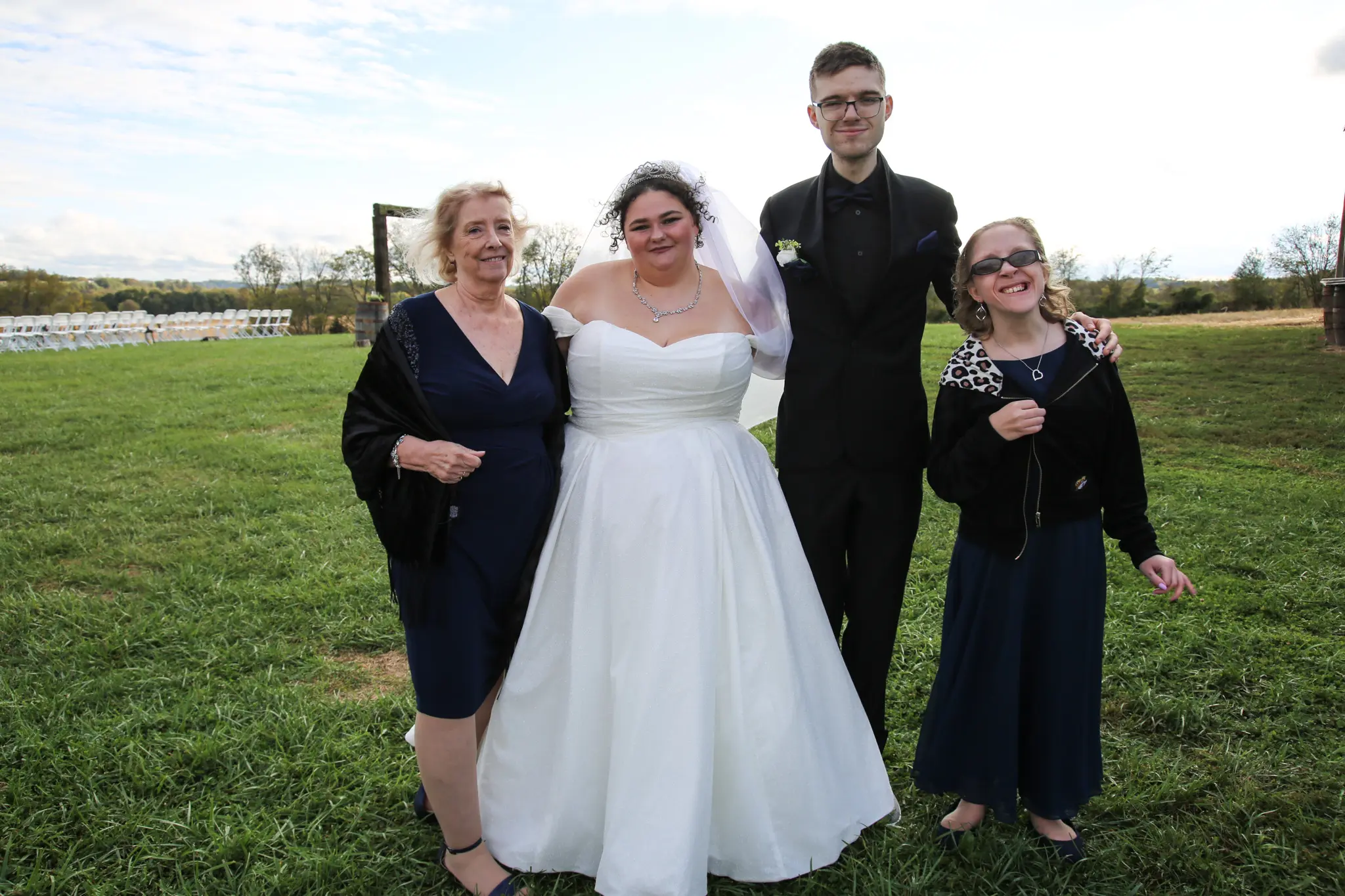 Bride wearing Anniston by Maggie Sottero with her family