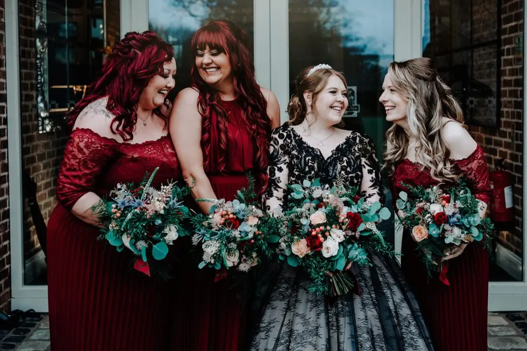 Bride Wearing Gothic Black Wedding Dress Called Zander By Maggie Sottero With Her Bridesmaids