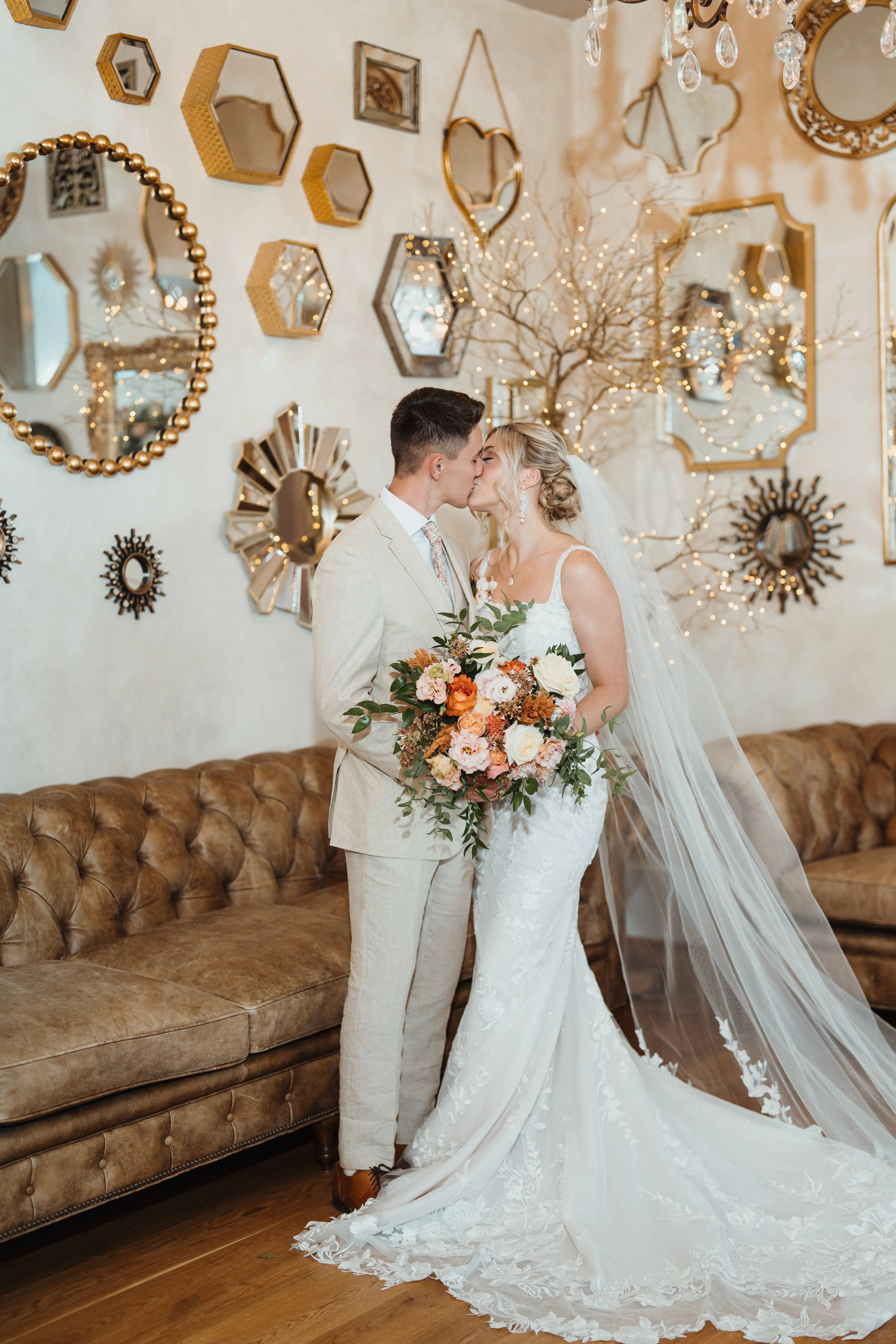 Bride wearing Albany wedding dress by Maggie Sottero kissing her husband