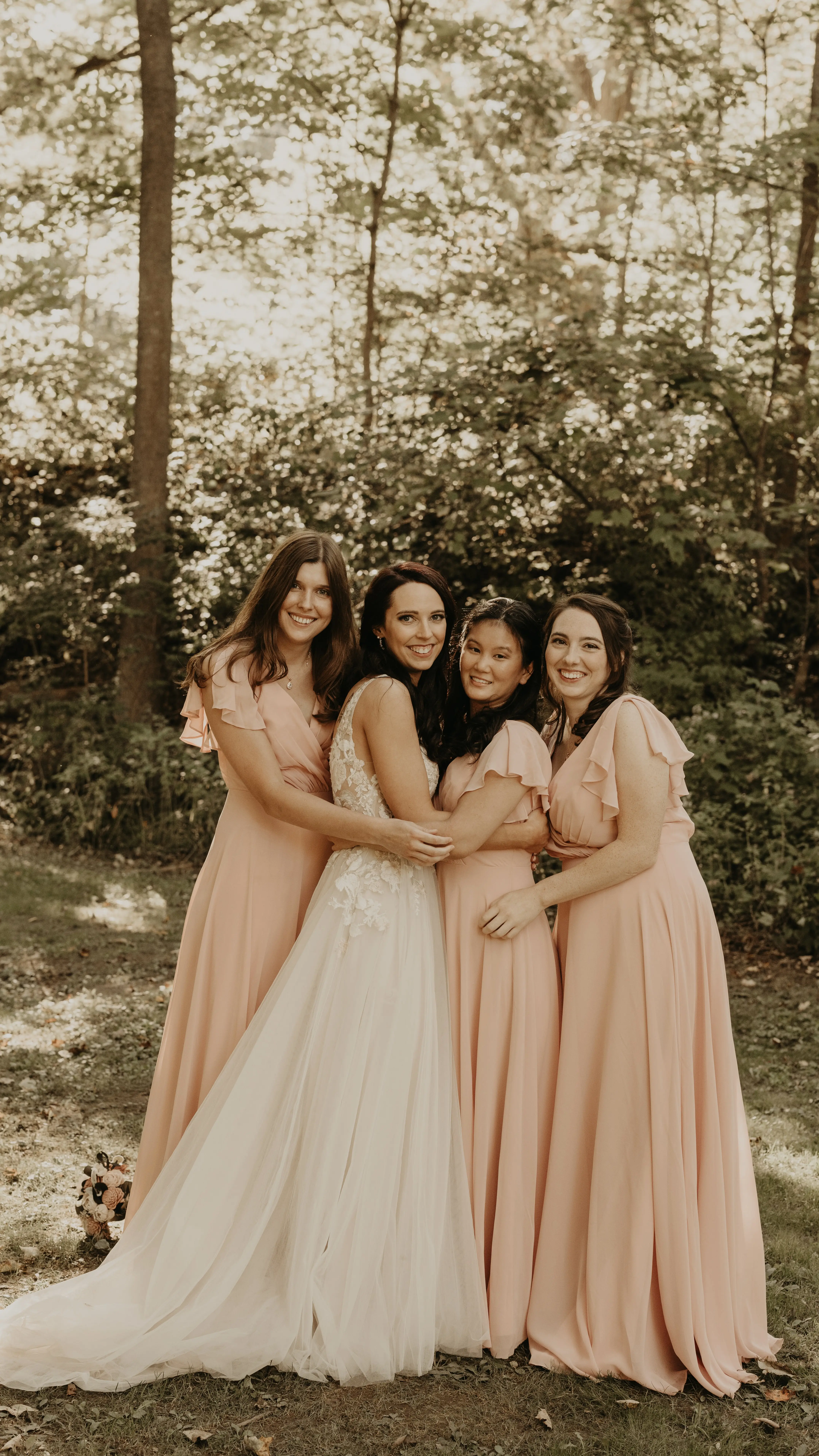 Bride In Lace And Tulle Wedding Dress Called Minerva By Rebecca Ingram With Bridesmaids In Blush