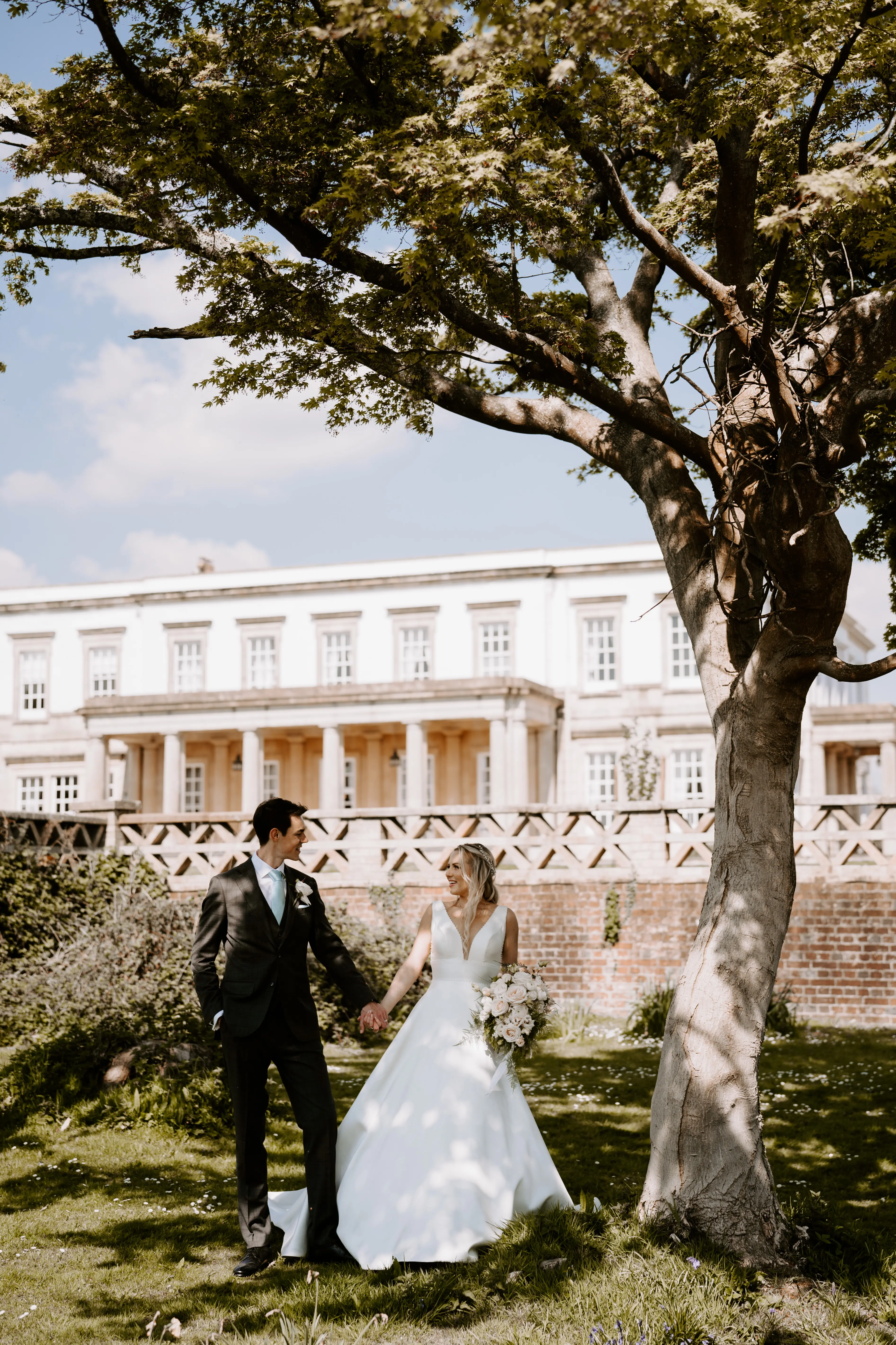 Groom With Bride Wearing Mikado A-Line Wedding Dress Raven By Maggie Sottero