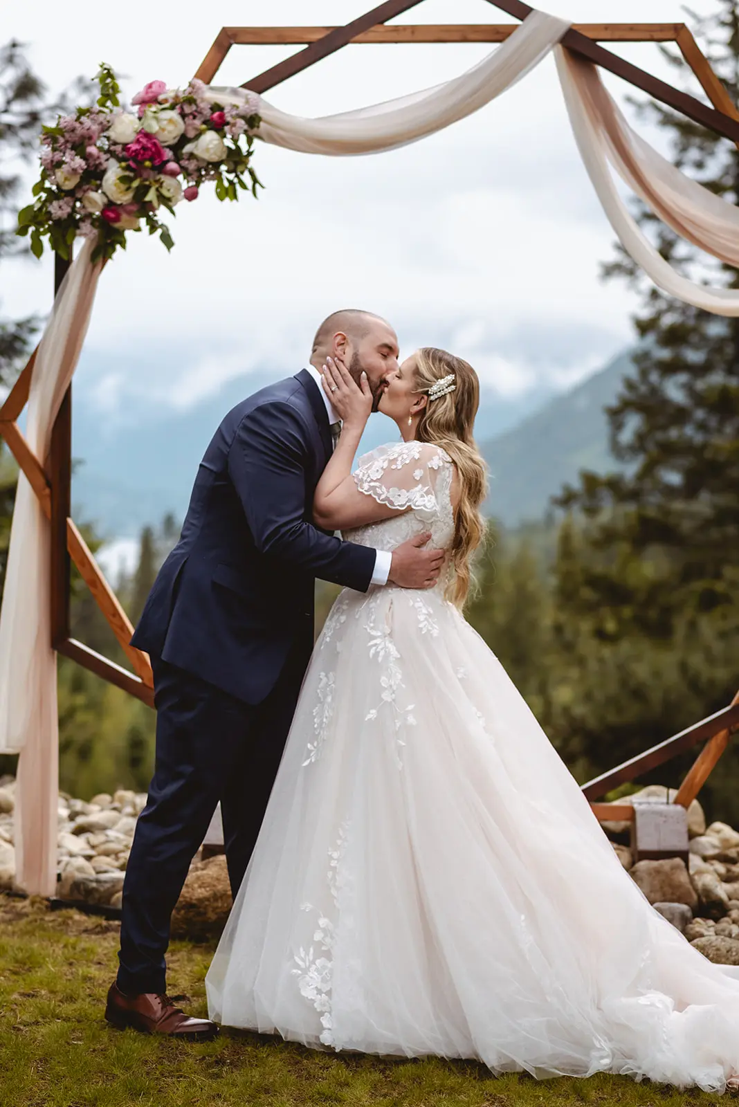 Bride Wearing Lace Aline Wedding Dress Called Harlem By Maggie Sottero Kissing Groom At The Altar