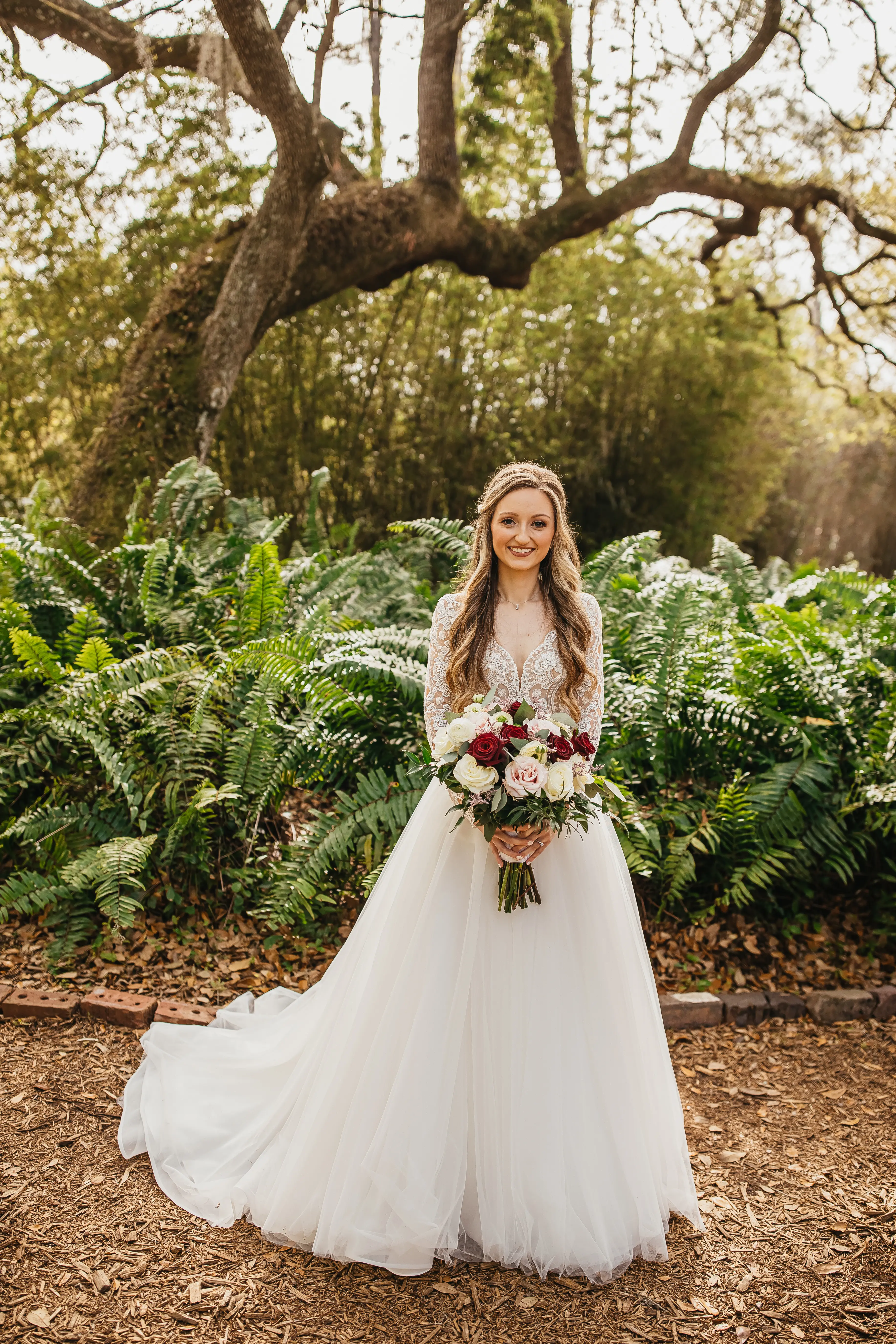 Bride Wearing Romantic Long Sleeved Ball Gown Mallory Dawn By Maggie Sottero