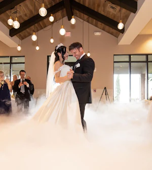 Bride wearing elegant satin ballgown called Kimora by Sottero and Midgley with groom