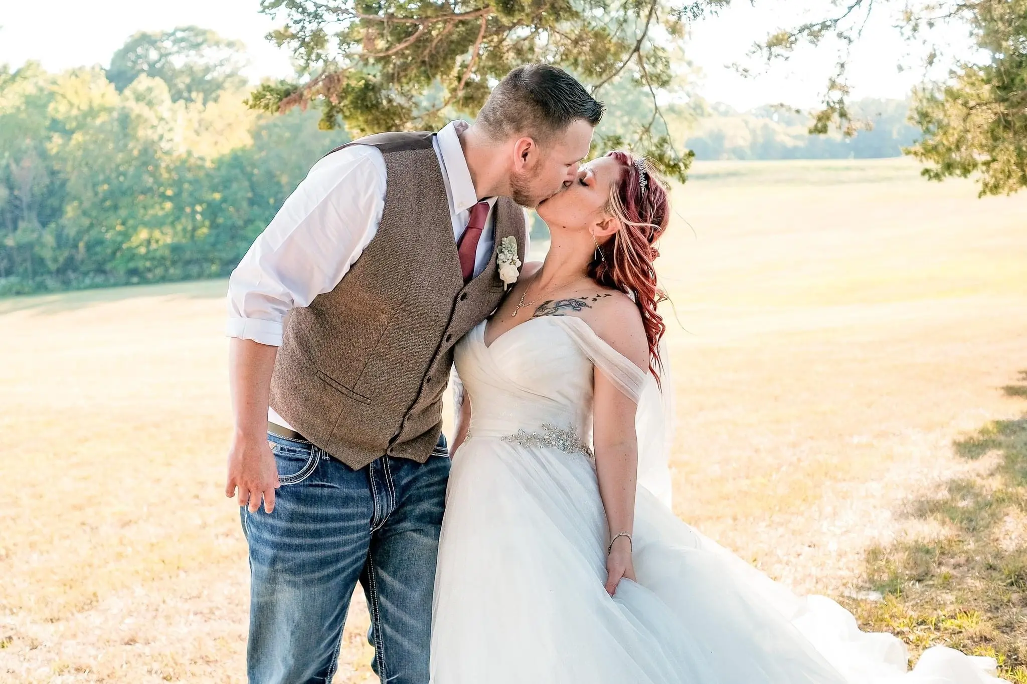 Bride Wearing Sparkly Princess Ballgown Wedding Dress Called Yasmin By Maggie Sottero Kissing Groom
