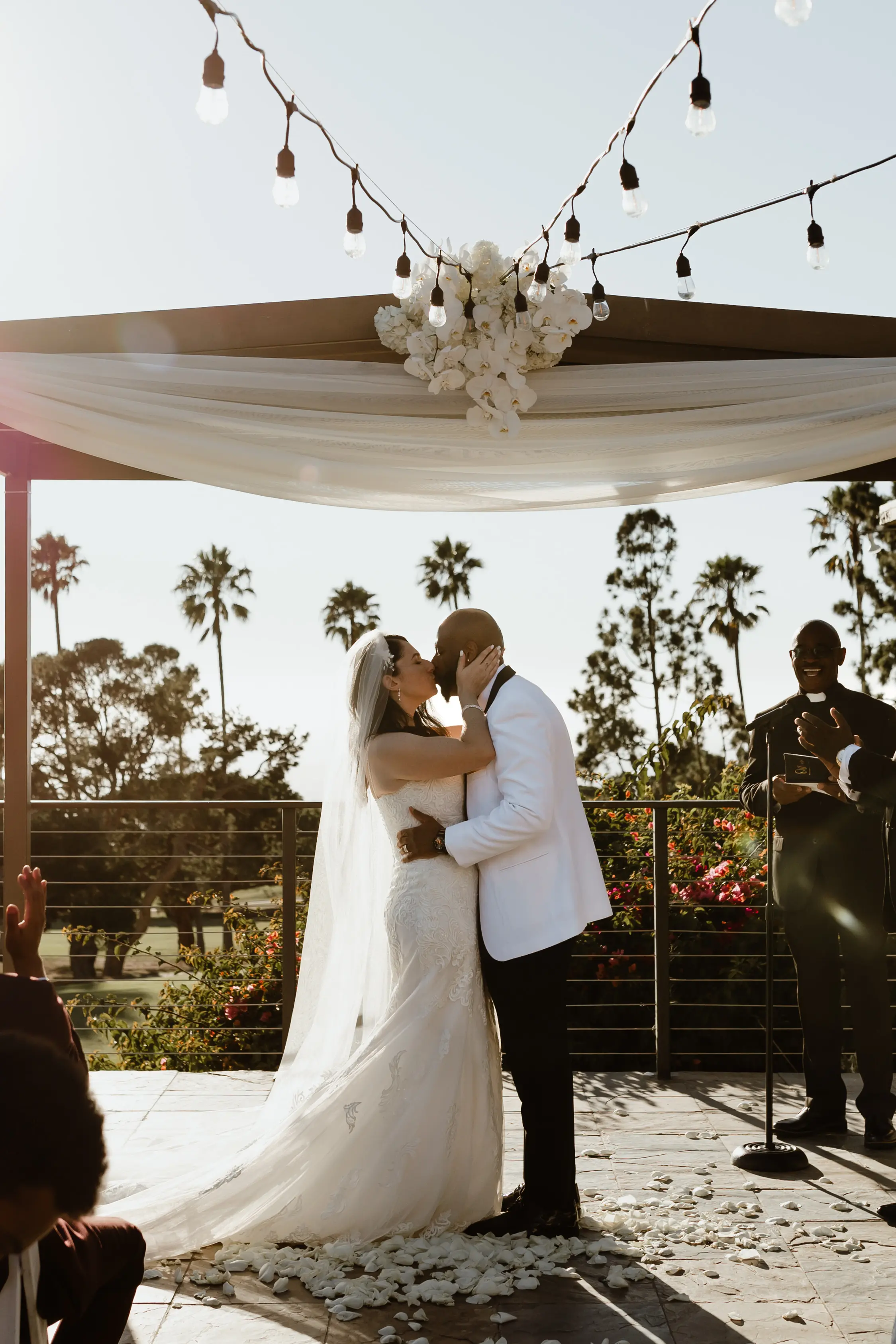 Bride Wearing Lace Wedding Dress Called Fiona By Maggie Sottero At Tropical Venue With Groom In White Suit