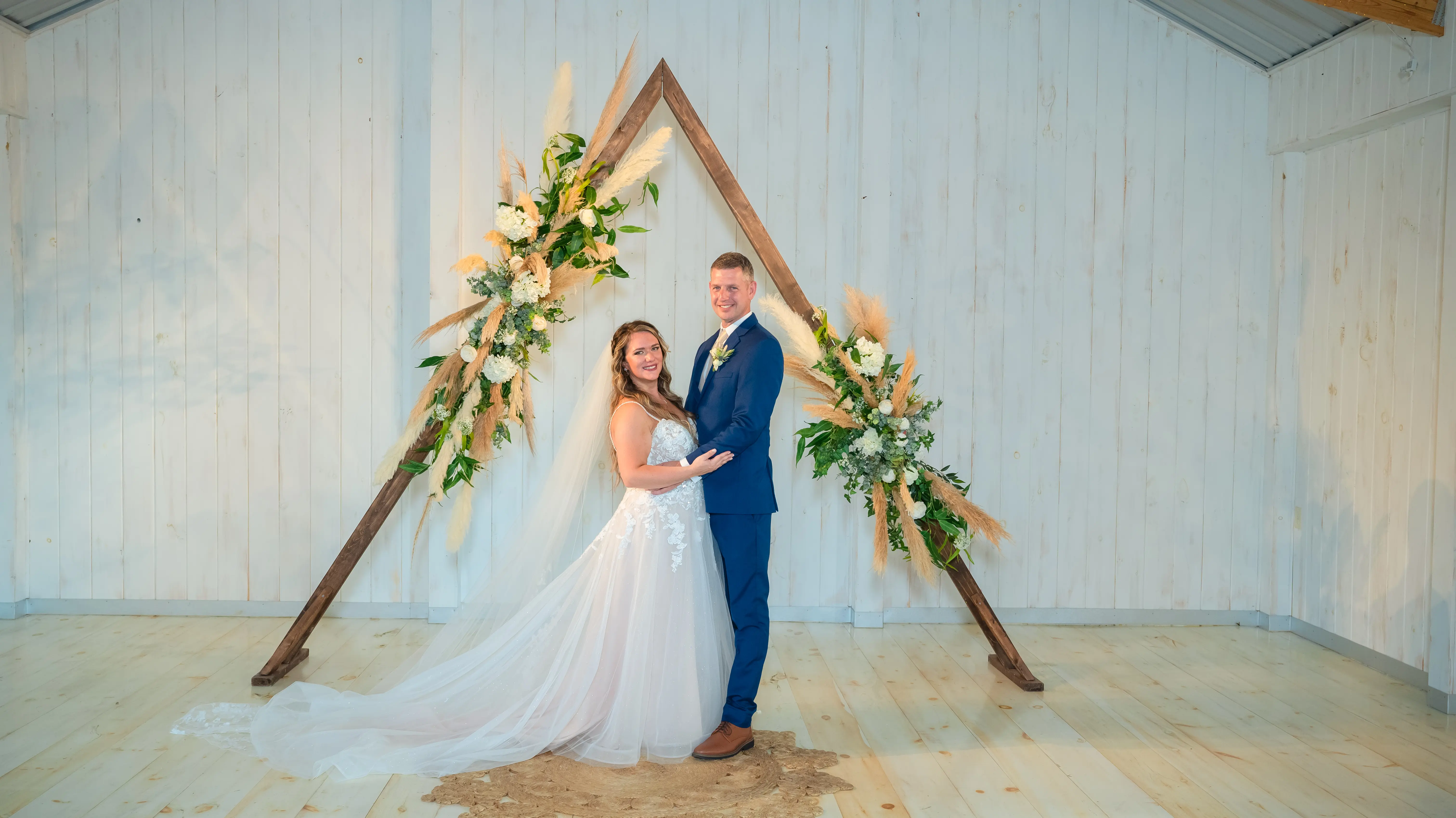 Bride Wearing Lace Princess Wedding Dress Called Stevie By Maggie Sottero With Groom Next To Alter