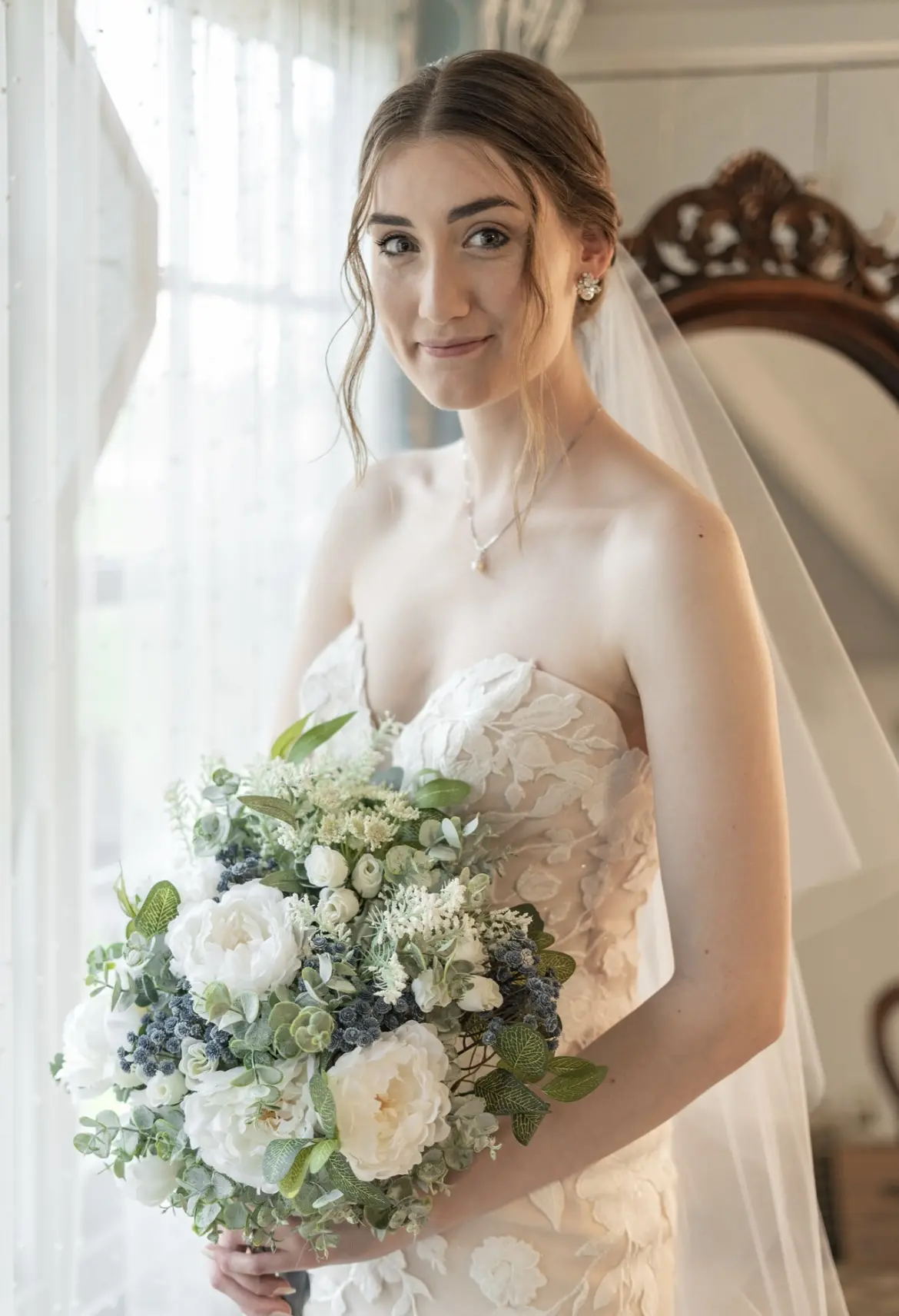Bride Wearing Strapless Mermaid Wedding Gown With Oversized Floral Lace Motifs Called Hattie By Rebecca Ingram