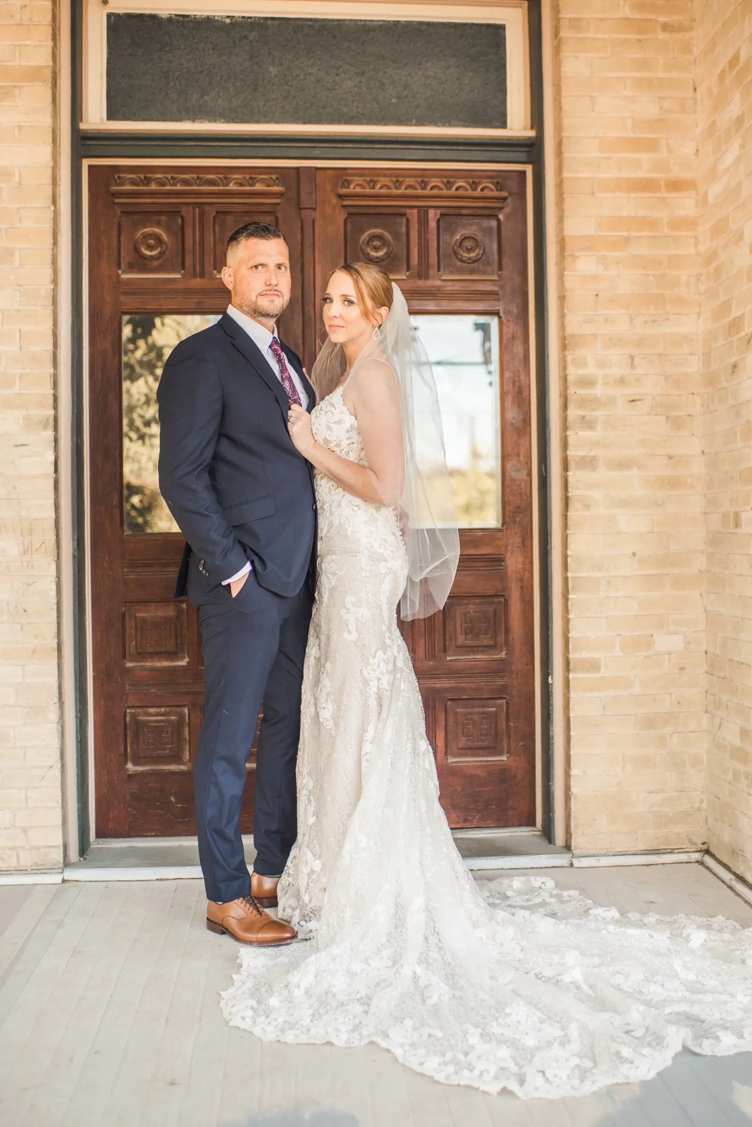 Bride Wearing Glamorous Lace And Sequin Wedding Dress Called Tuscany By Maggie Sottero With Groom And Simple Veil