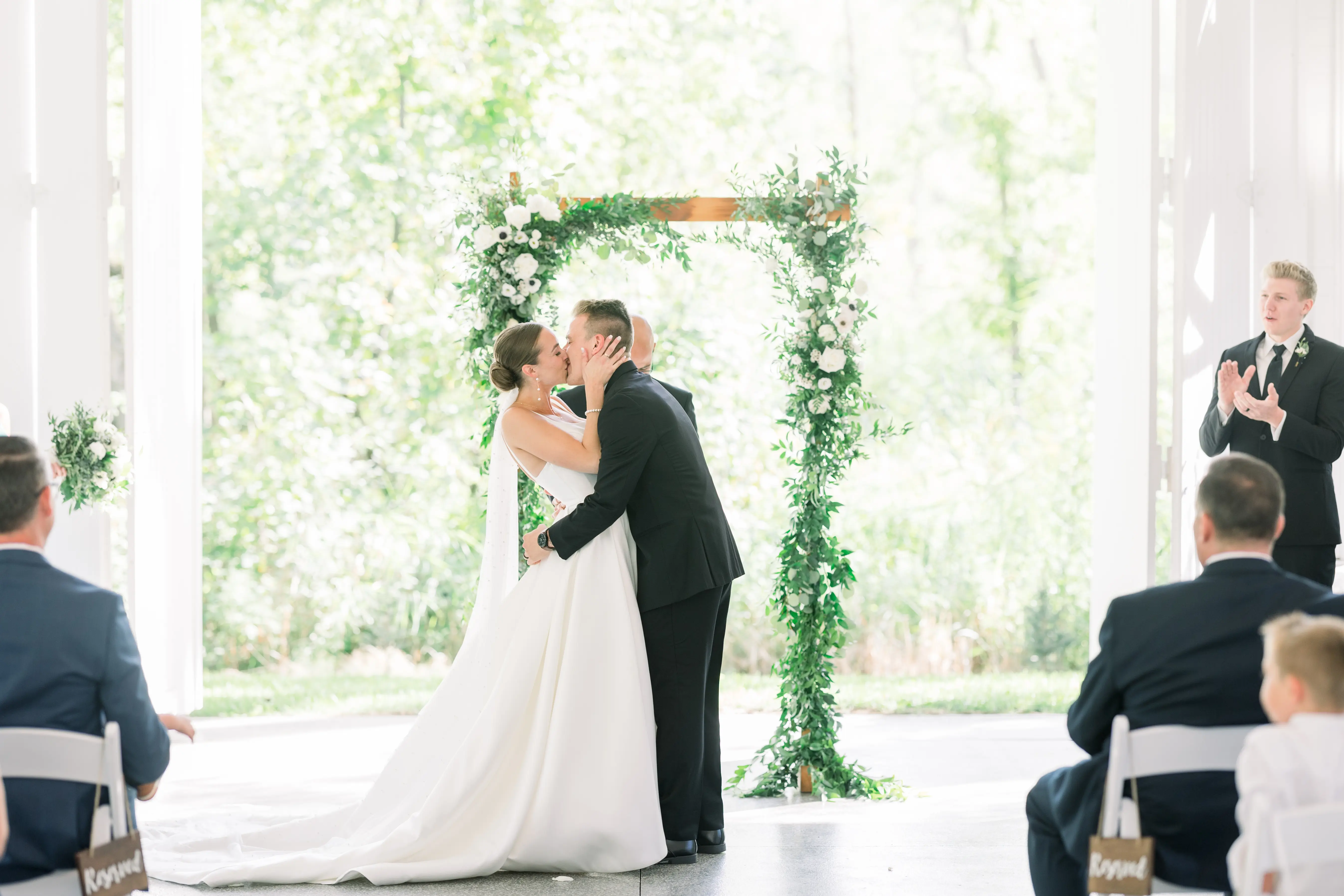 Bride Wearing Classic A-Line Wedding Dress Called Selena By Maggie Sottero Kissing Groom At The Ceremony
