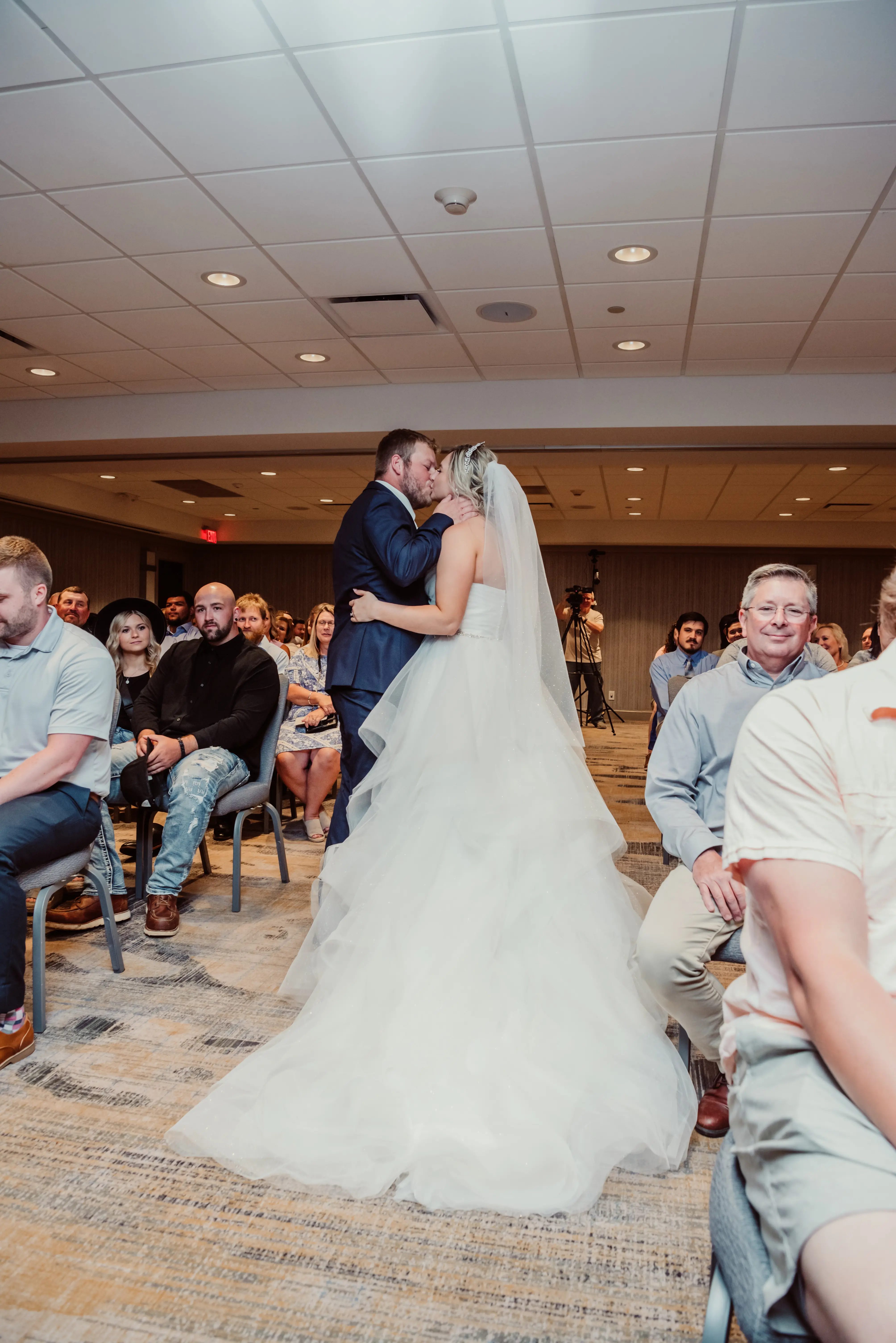 Bride in tulle princess dress called Yasmin by Maggie Sottero with groom