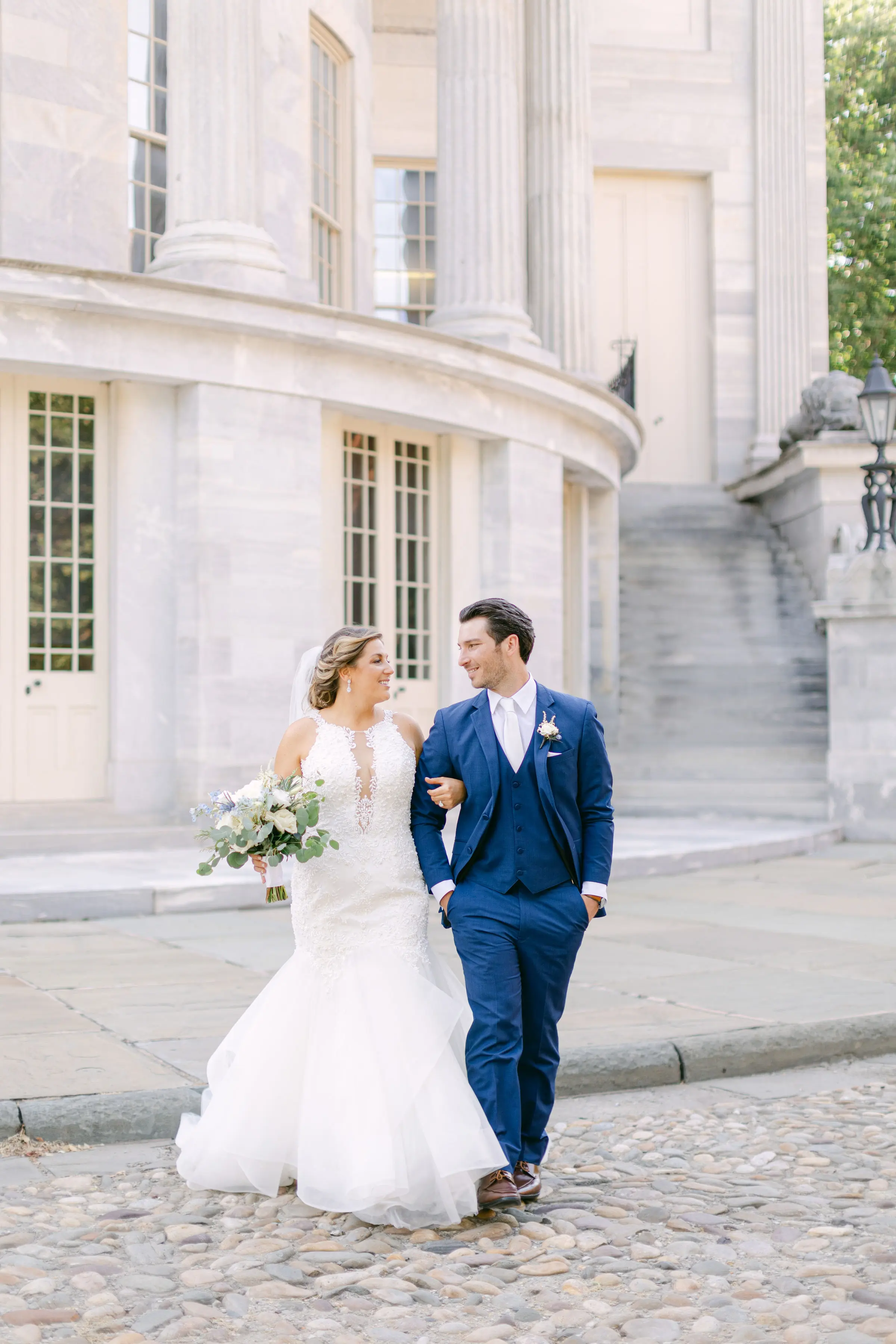 bride with groom wearing organza mermaid wedding dress