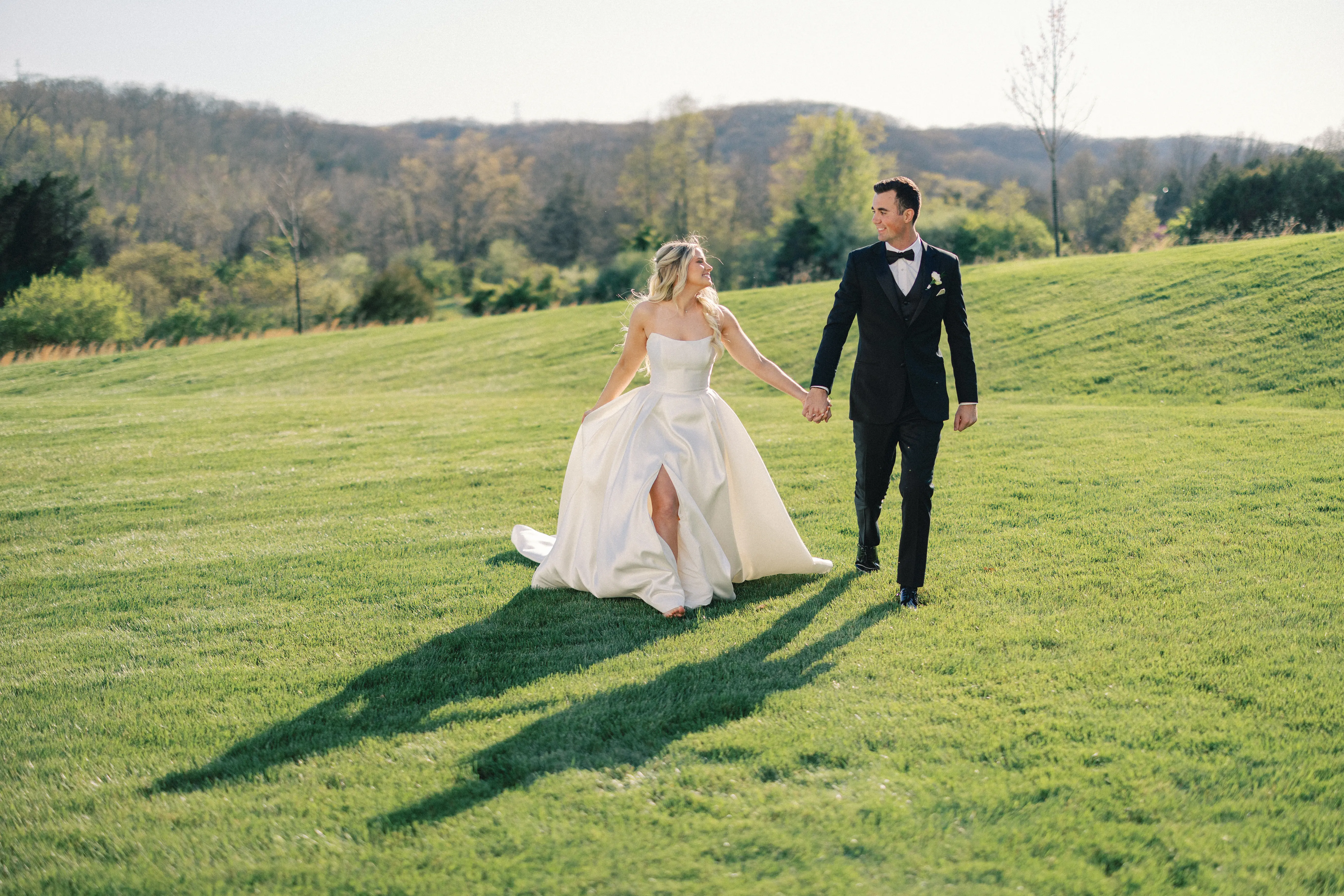 Bride wearing Selena by Maggie Sottero walking with her husband