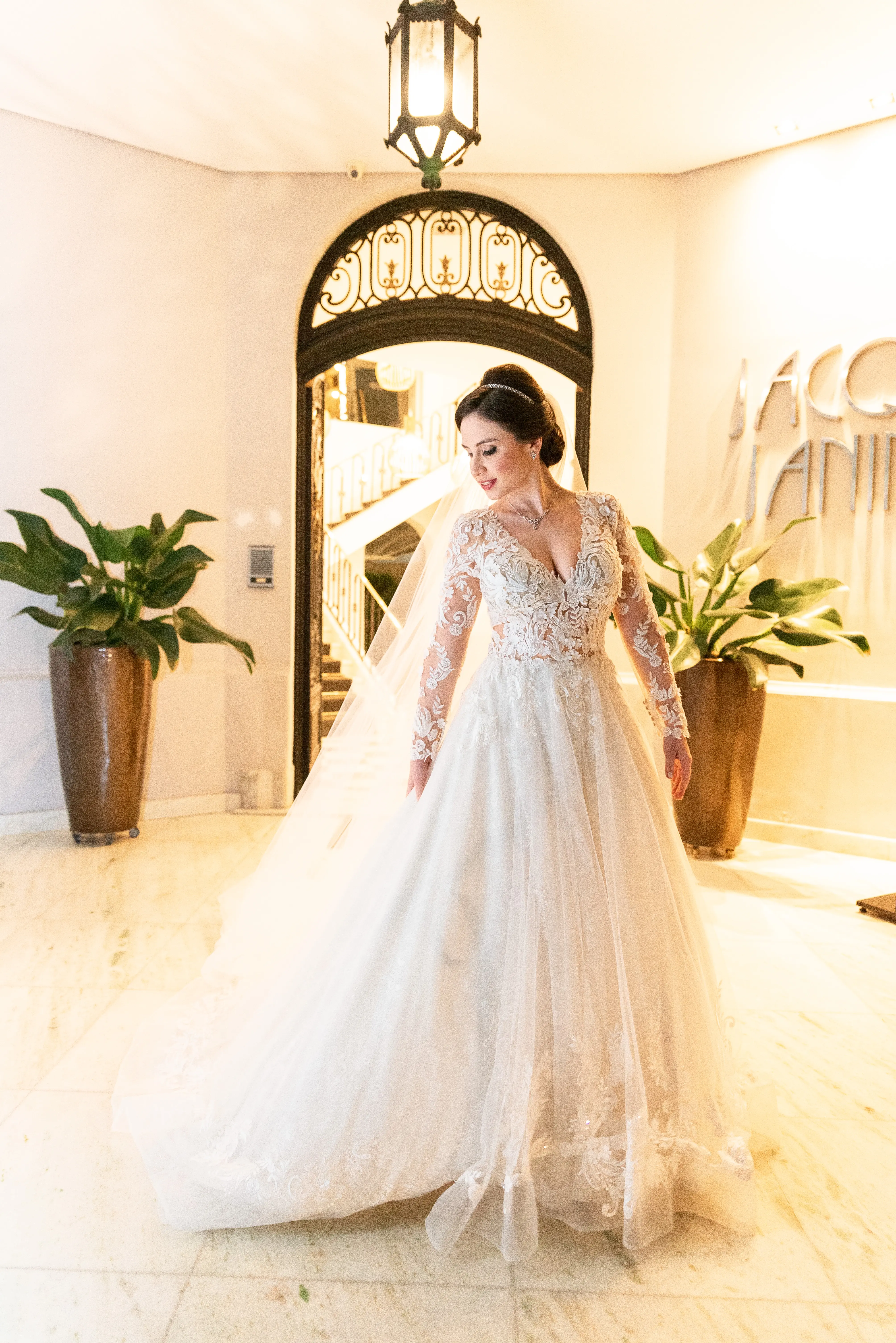 Bride Smiling While Wearing Lace A-Line Wedding Dress Called Zander By Sottero And Midgley