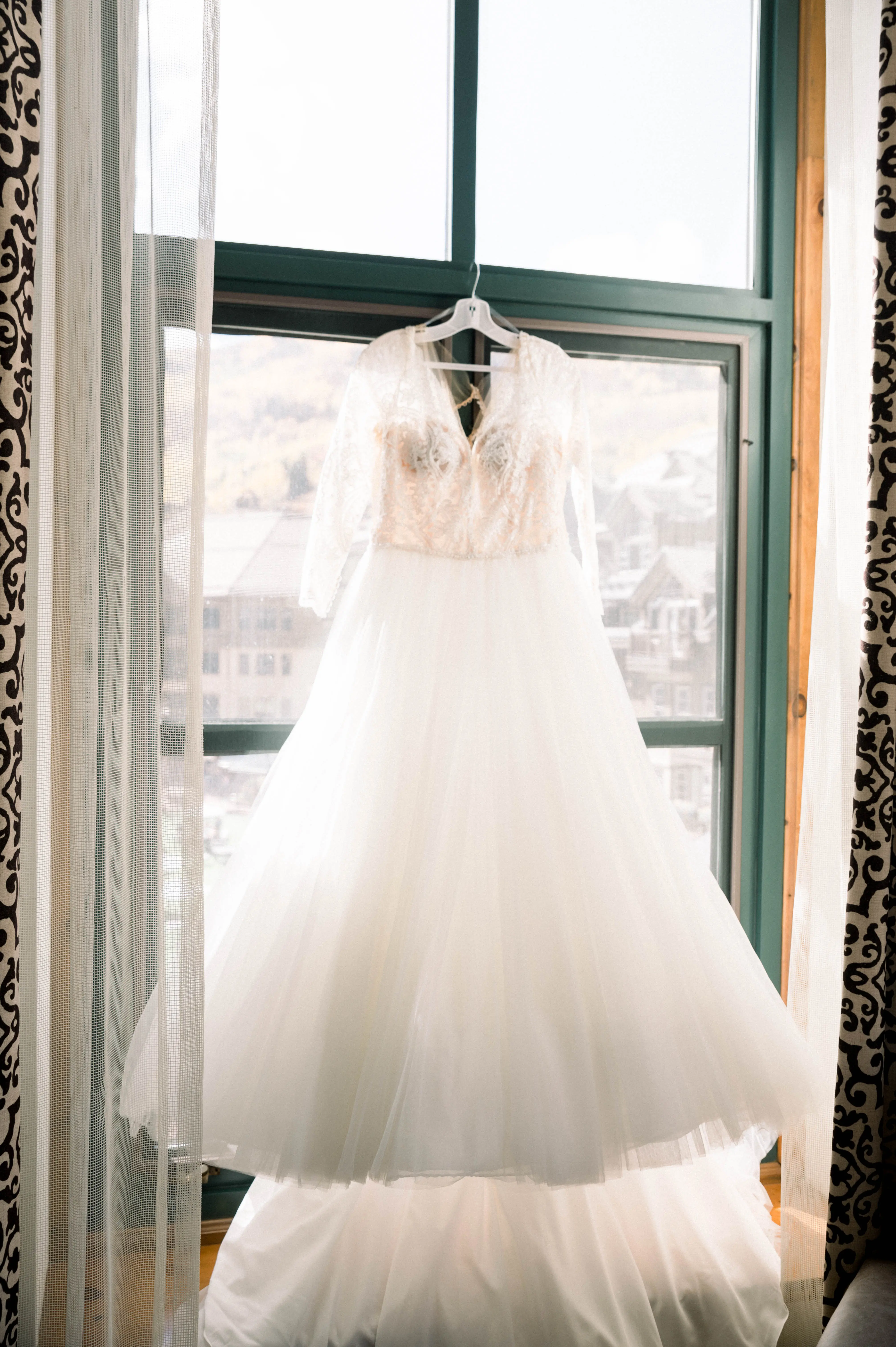 Princess Wedding Dress Called Mallory Dawn By Maggie Sottero Hanging on a Window