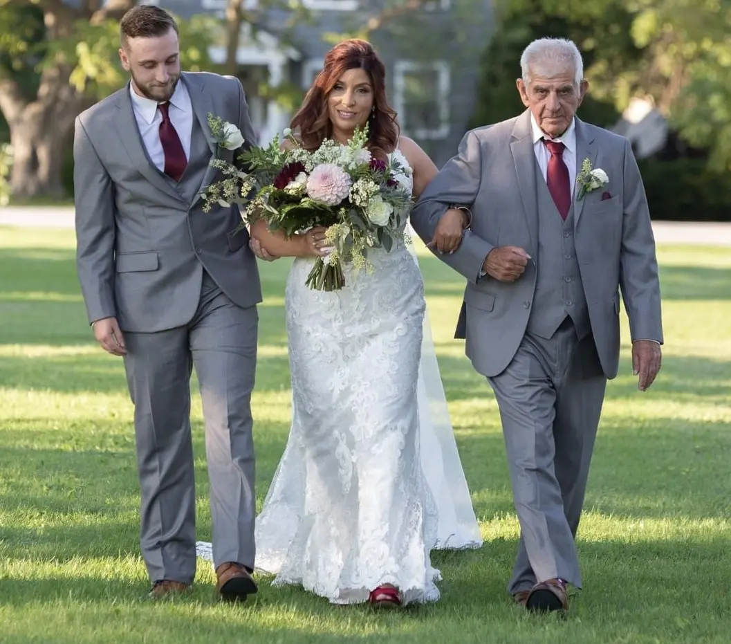 Bride Wearing Sexy Mermaid Wedding Dress Called Tuscany By Maggie Sottero Walking With Father Holding Bouquet