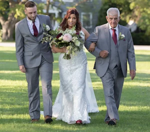 Bride Wearing Sexy Mermaid Wedding Dress Called Tuscany By Maggie Sottero Walking With Father Holding Bouquet
