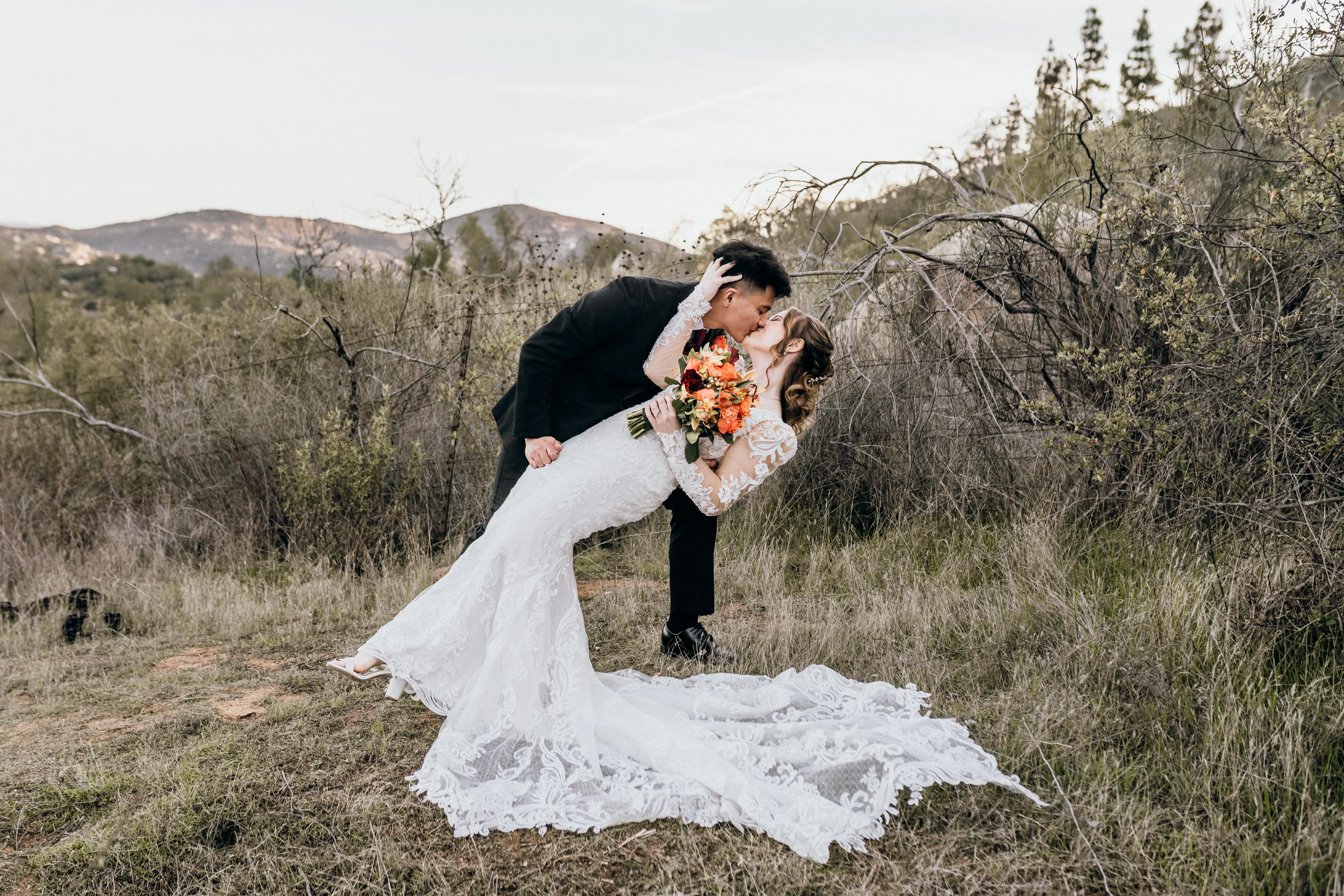 Bride In Embroidered Lace Sheath Dress Hamilton Sottero Midgley With Groom