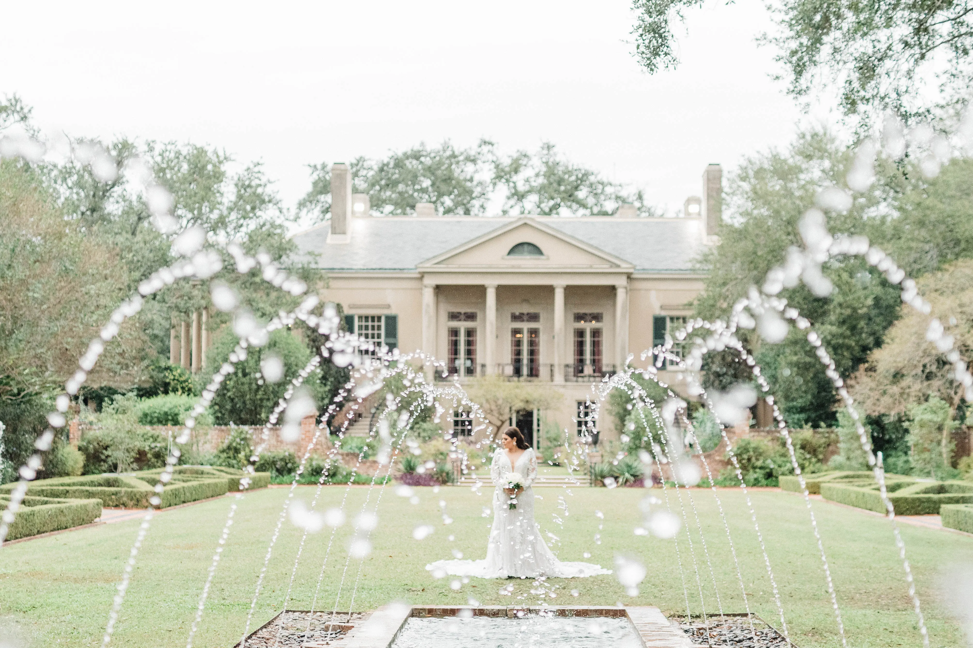 Bride In Elegant Floral Wedding Dress Called Cruz By Sottero And Midgley With Fountains And Mansion