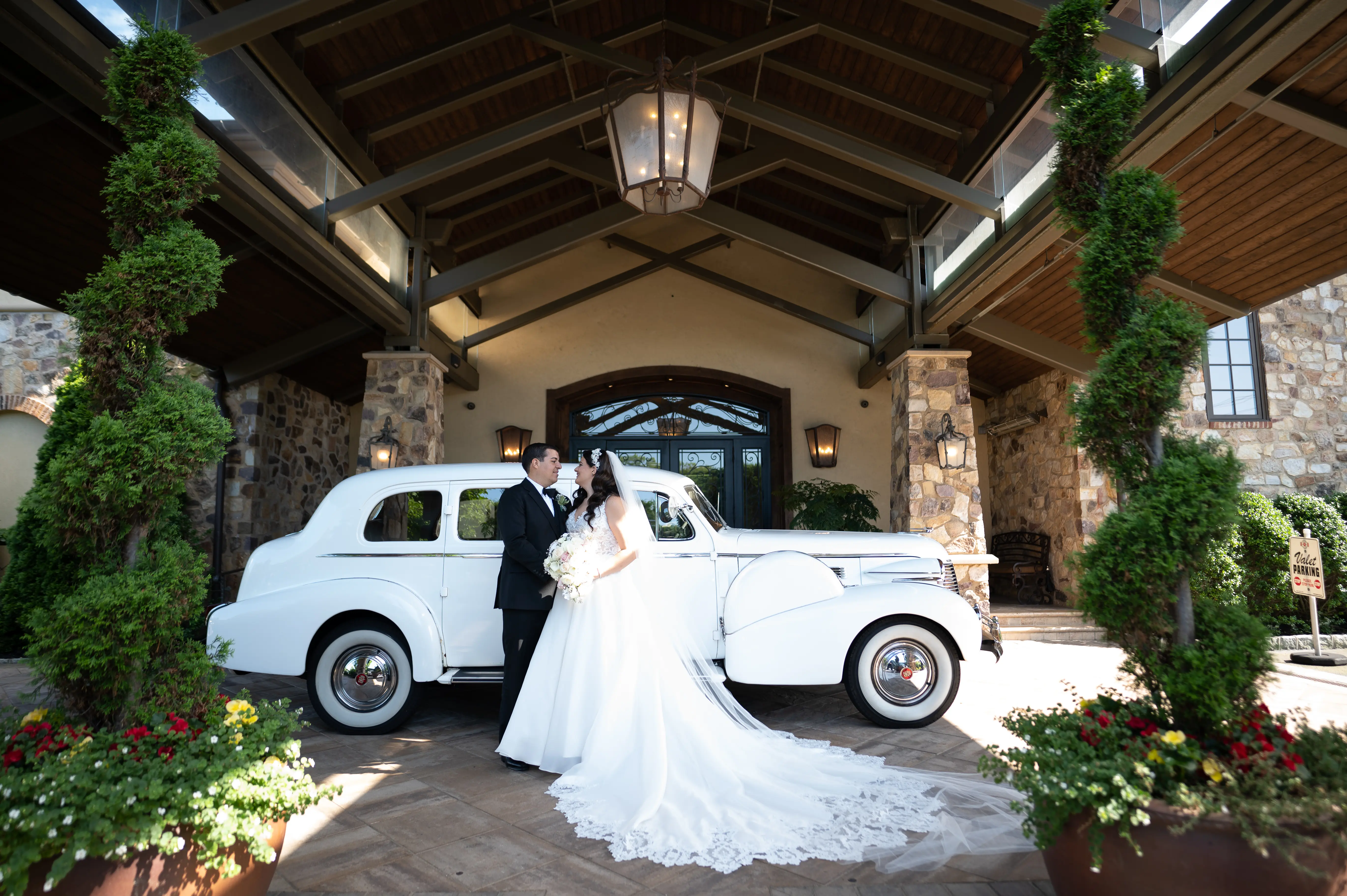 Bride In A-line Wedding Dress Named Savannah By Maggie Sottero Bride and Groom By Vintage Car