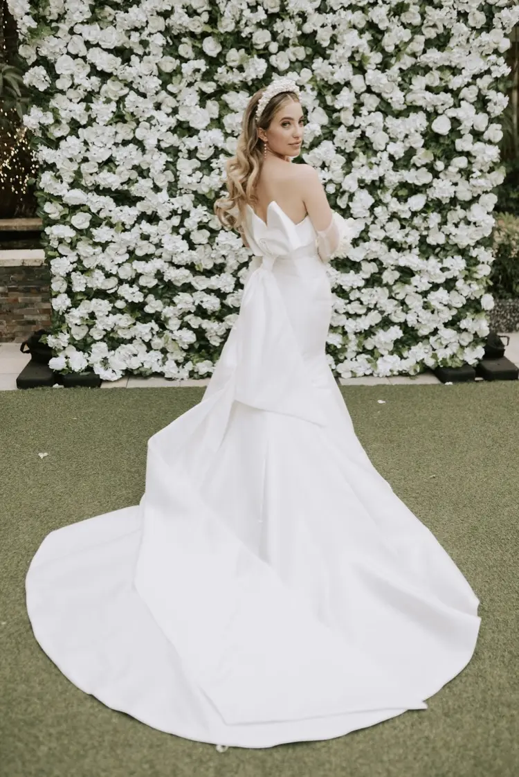 Bride Wearing Simple Sheath Satin Dress With Back Bow Mitchell By Maggie Sottero